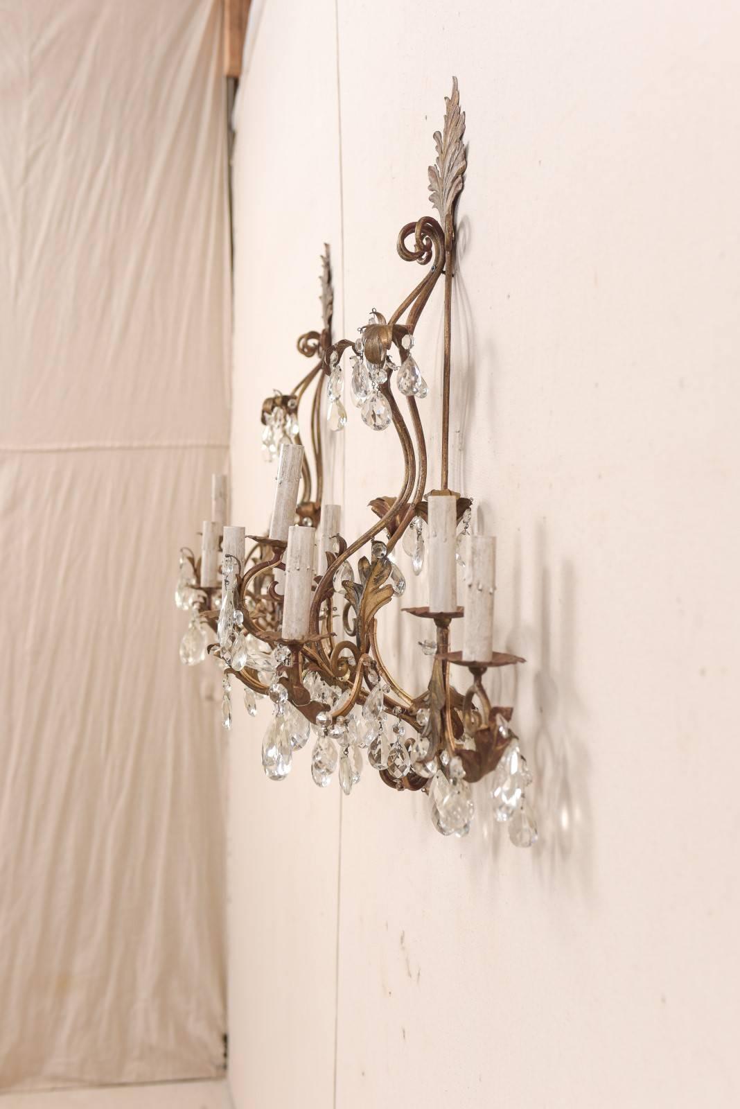 20th Century Pair of Mid-Century Seven-Light Crystal and Iron Sconces with Leaf Crest Tops For Sale