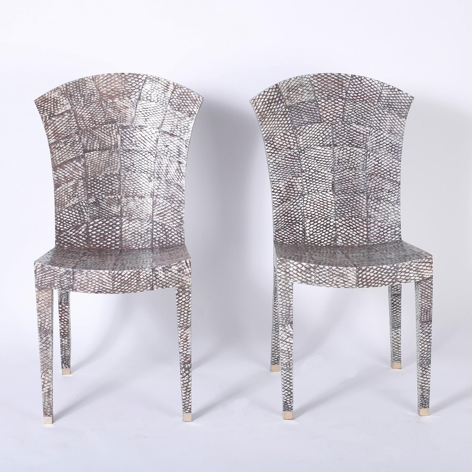 Chic pair of midcentury handmade wood dining chairs with a simple sleek form covered in shagreen or shark skin. Signed Maitland-Smith on the bottoms. Priced individually. .