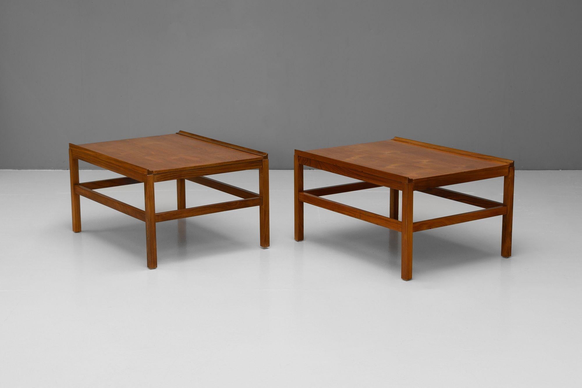 Pair of mid-century teak side tables. Re-finished.

England circa 1960.

H 44cm x W 62cm x D 80cm