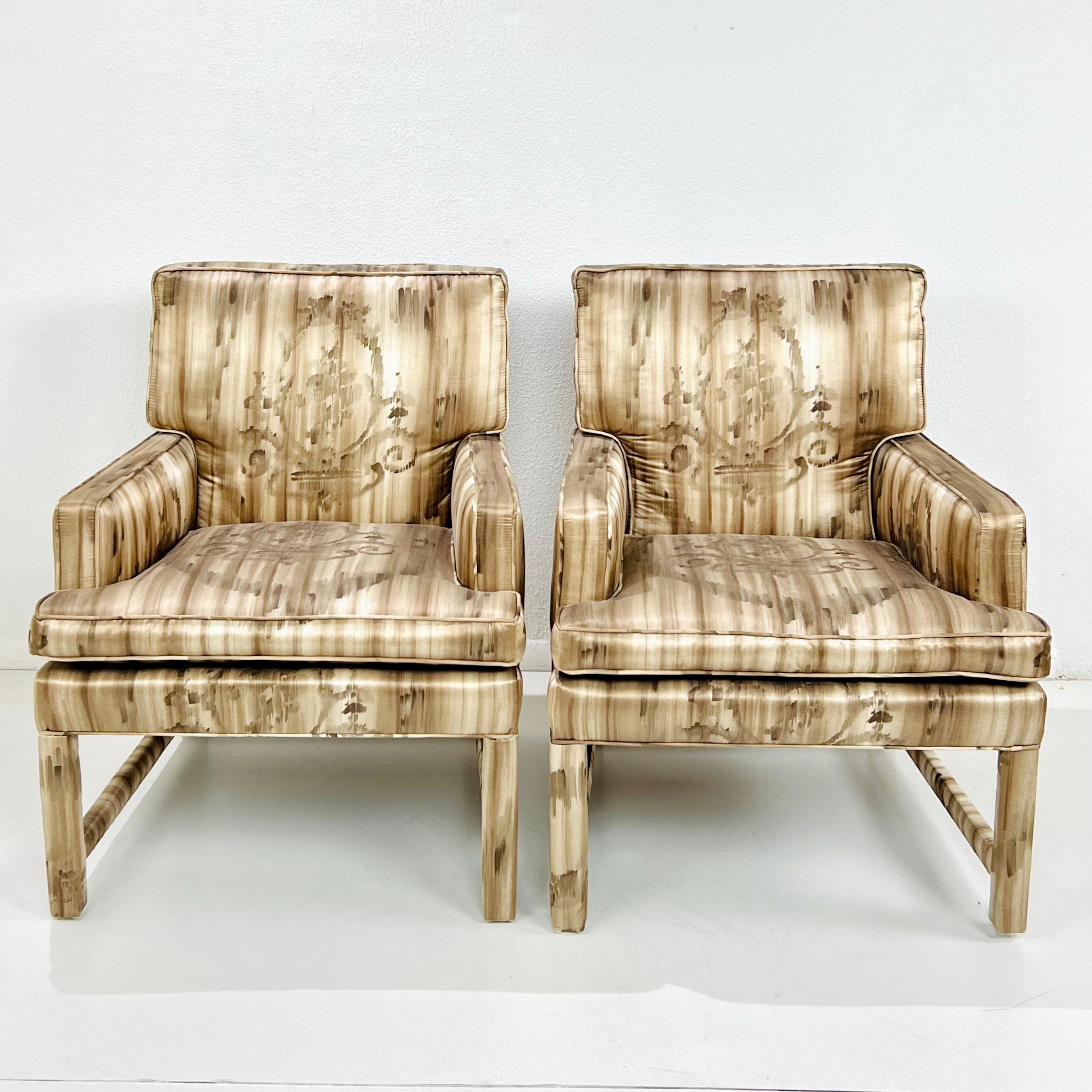 Pair of Parsons style armchairs upholstered in a luxurious, patterned rose taupe silk. Made in the 60s and reupholstered in recent years. Both frame and upholstery in very good condition. 