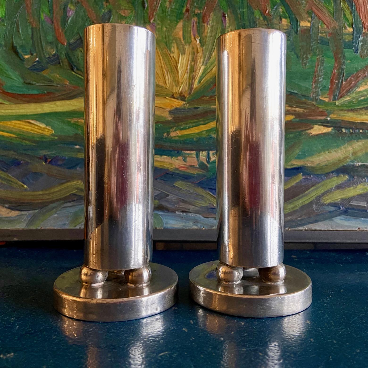 An unusual pair of silver plated soliflore vases / candle holders on of unusual geometric design, by Arthur Krupp, Milano, and most probably designed by Gio Ponti. 
They could possibly be used as candleholders for large candles.
Provenance The