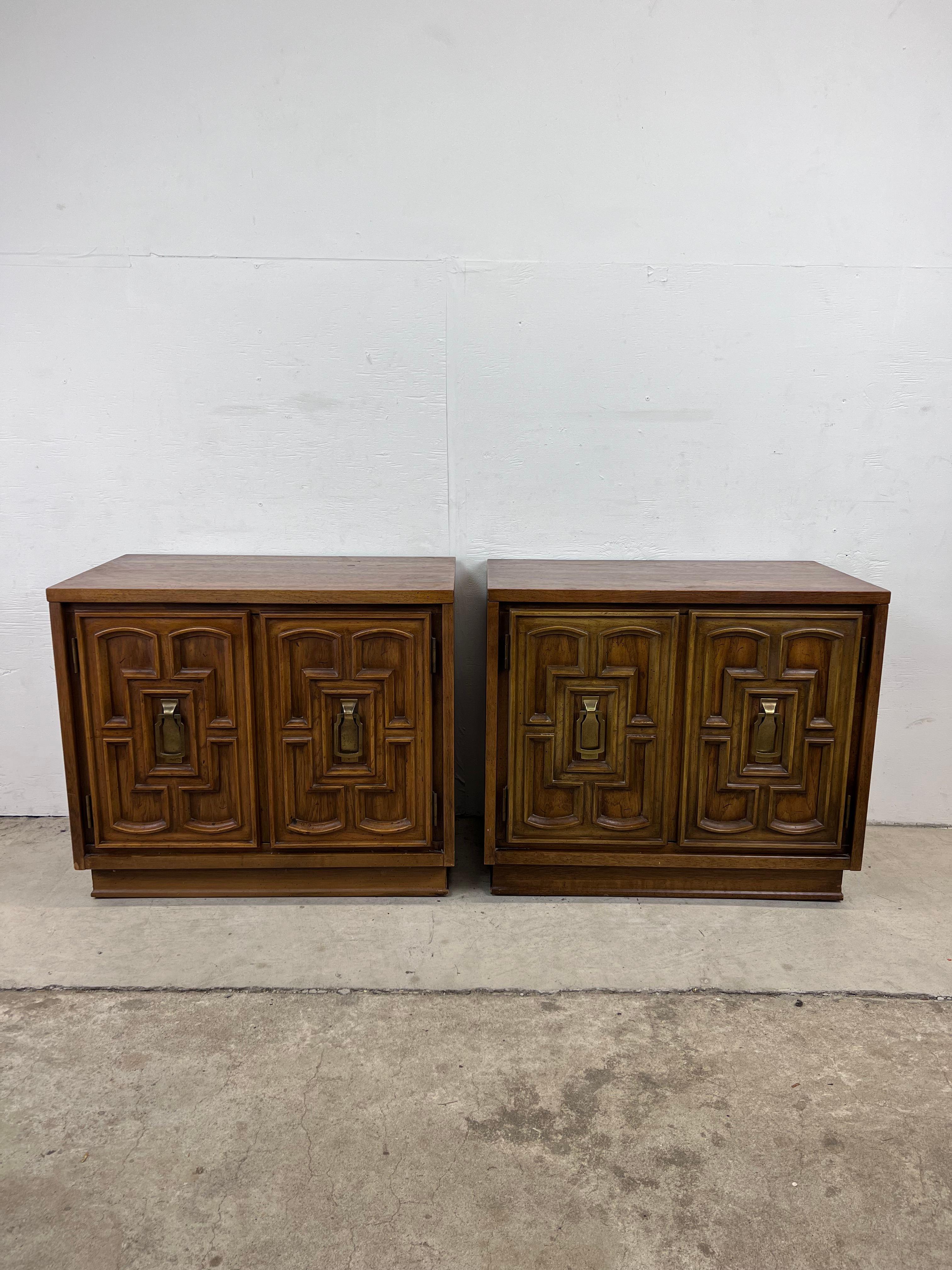 This pair of mid century Spanish Revival style nightstands feature hardwood construction, oakwood veneer with original finish, and two cabinet doors with brass hardware.?? 

   

