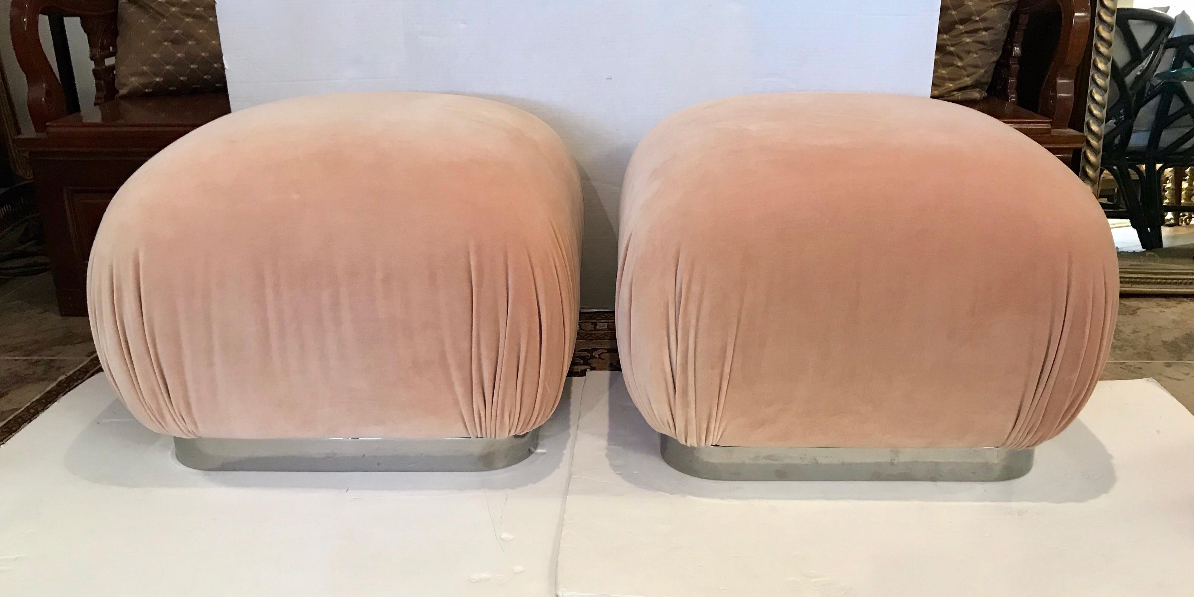 Iconic pair of matching Karl Springer style poufs or ottomans that sit on a chrome base.
The fabric is mohair, the color peach and the scale, perfect!