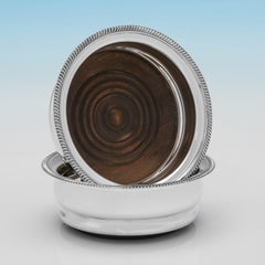 Pair of mid century sterling silver wine coasters made in 1968 by C. J. Vander