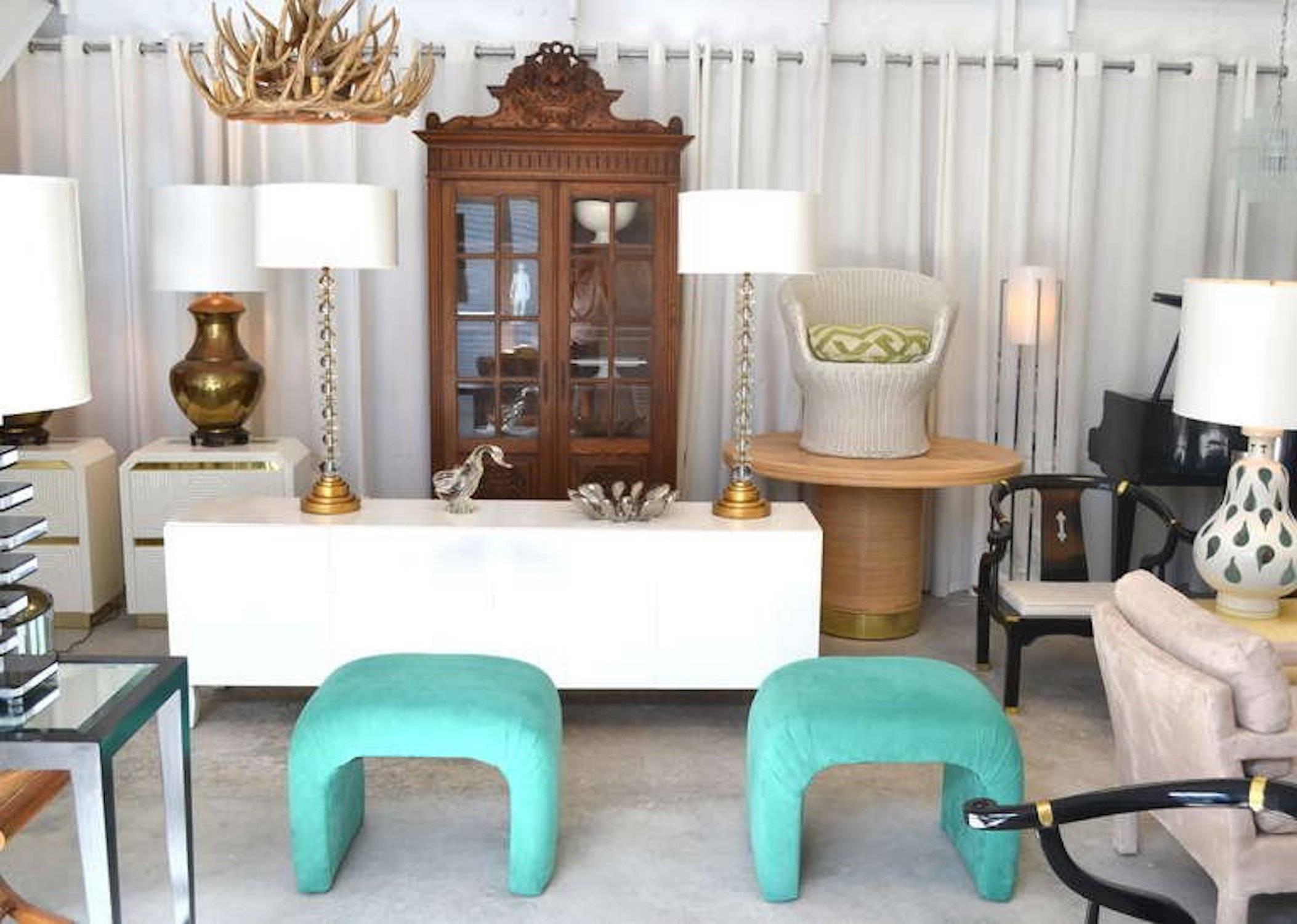 Pair of midcentury upholstered stools or ottomans circa 1970s. These glamorous waterfall edge benches are upholstered in ultra suede.