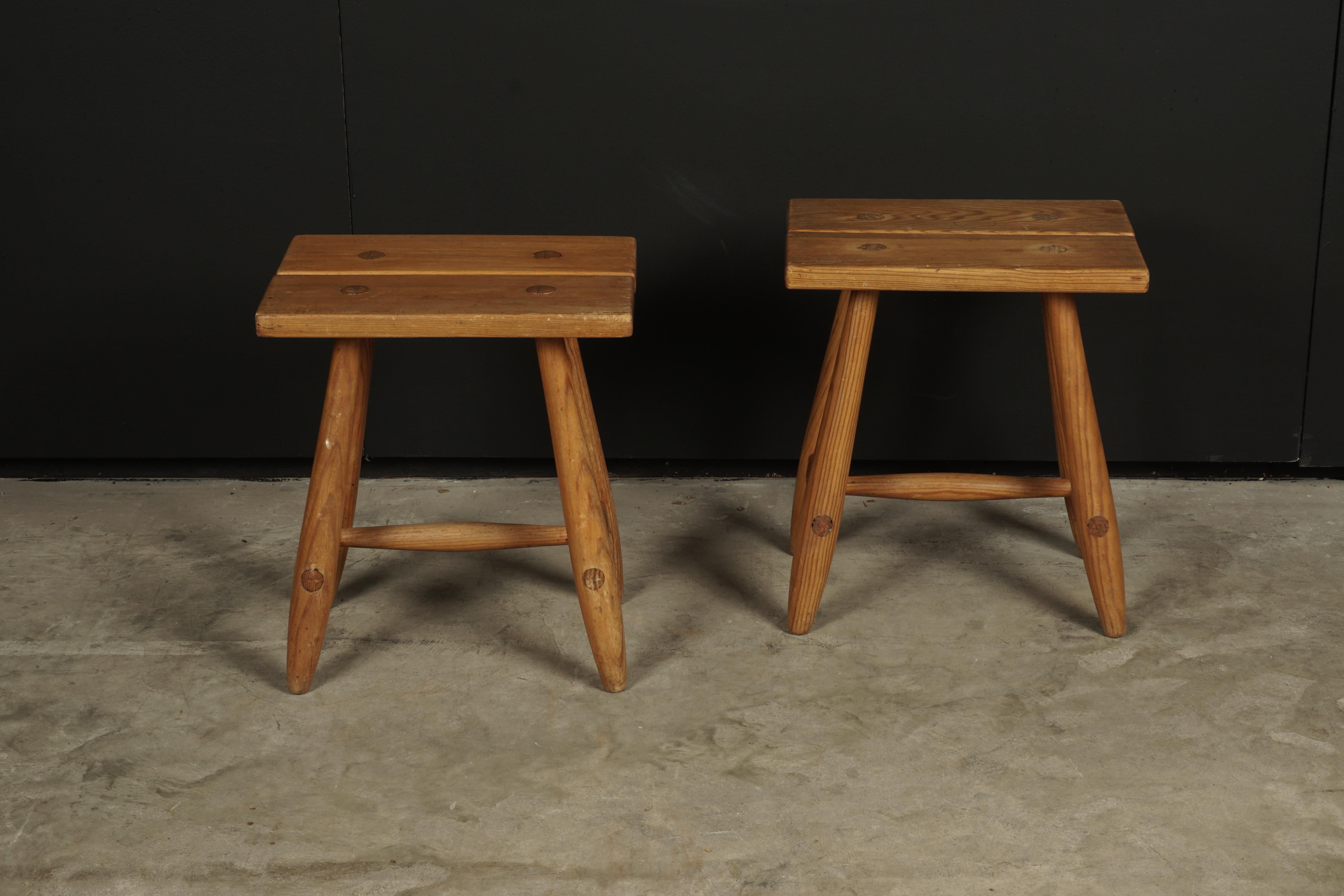 Pair of midcentury stools from Sweden, circa 1960. Light wear and patina. Solid pine construction.
