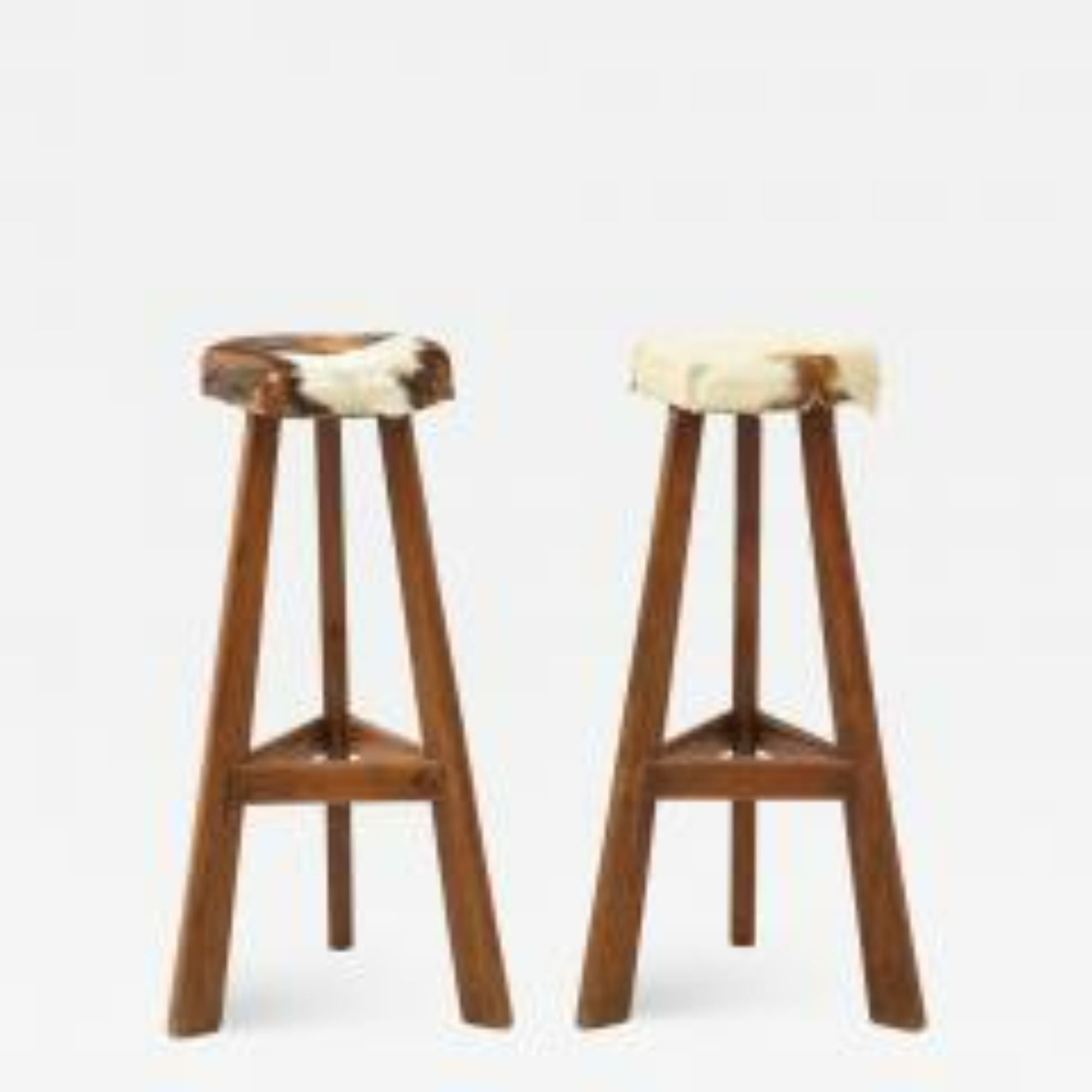 Pair of French midcentury Stools with Cowhide Seats

Stunning pair of French midcentury stools.
Elegant tapered wood legs, plush cowhide fur seats, and handsome joinery details.

Additional Information:
Materials: Wood, Cowhide Fur
Origin: