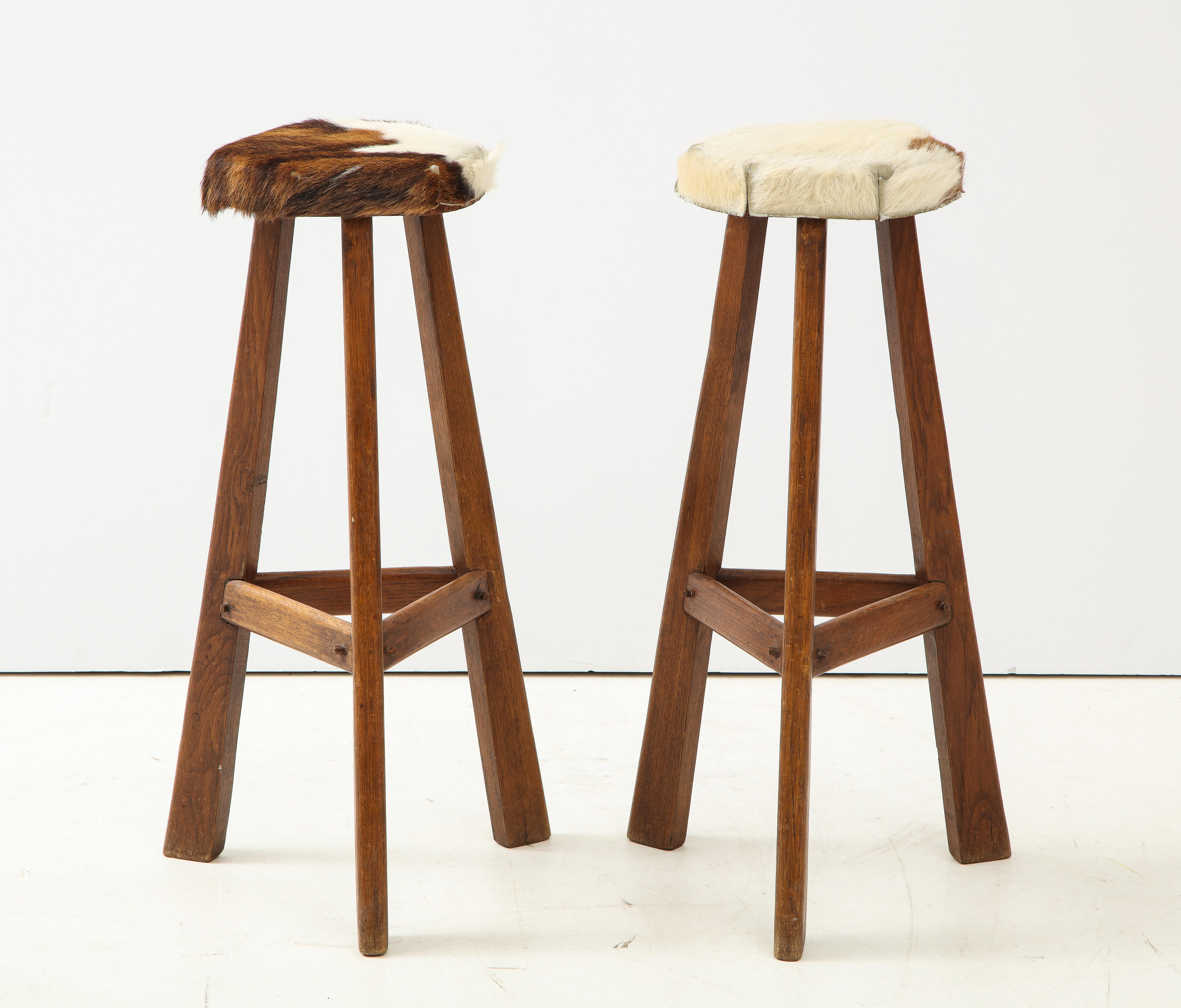 Modern Pair of Midcentury Stools with Cowhide Seats, France, circa 1960 For Sale