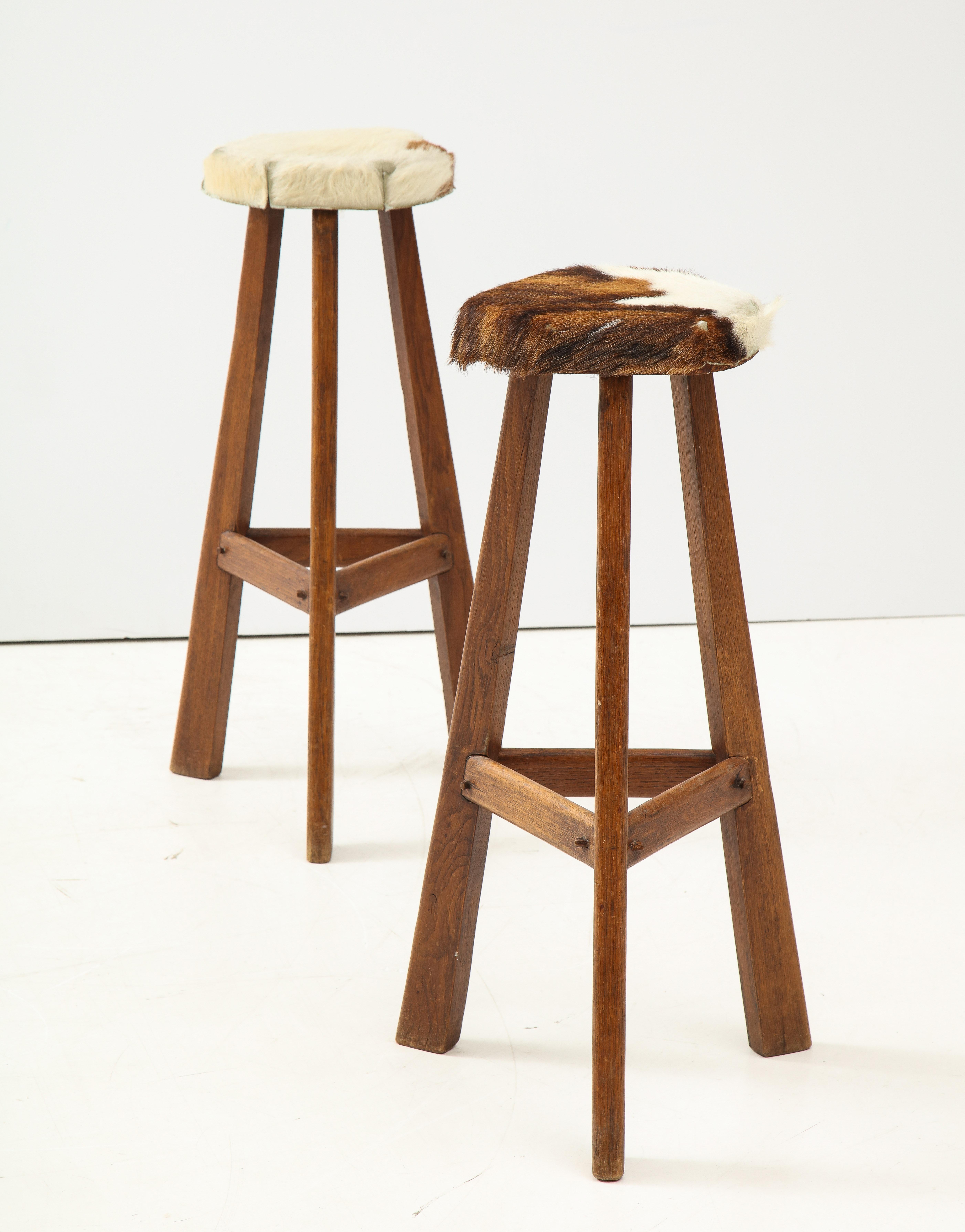 French Pair of Midcentury Stools with Cowhide Seats, France, circa 1960 For Sale