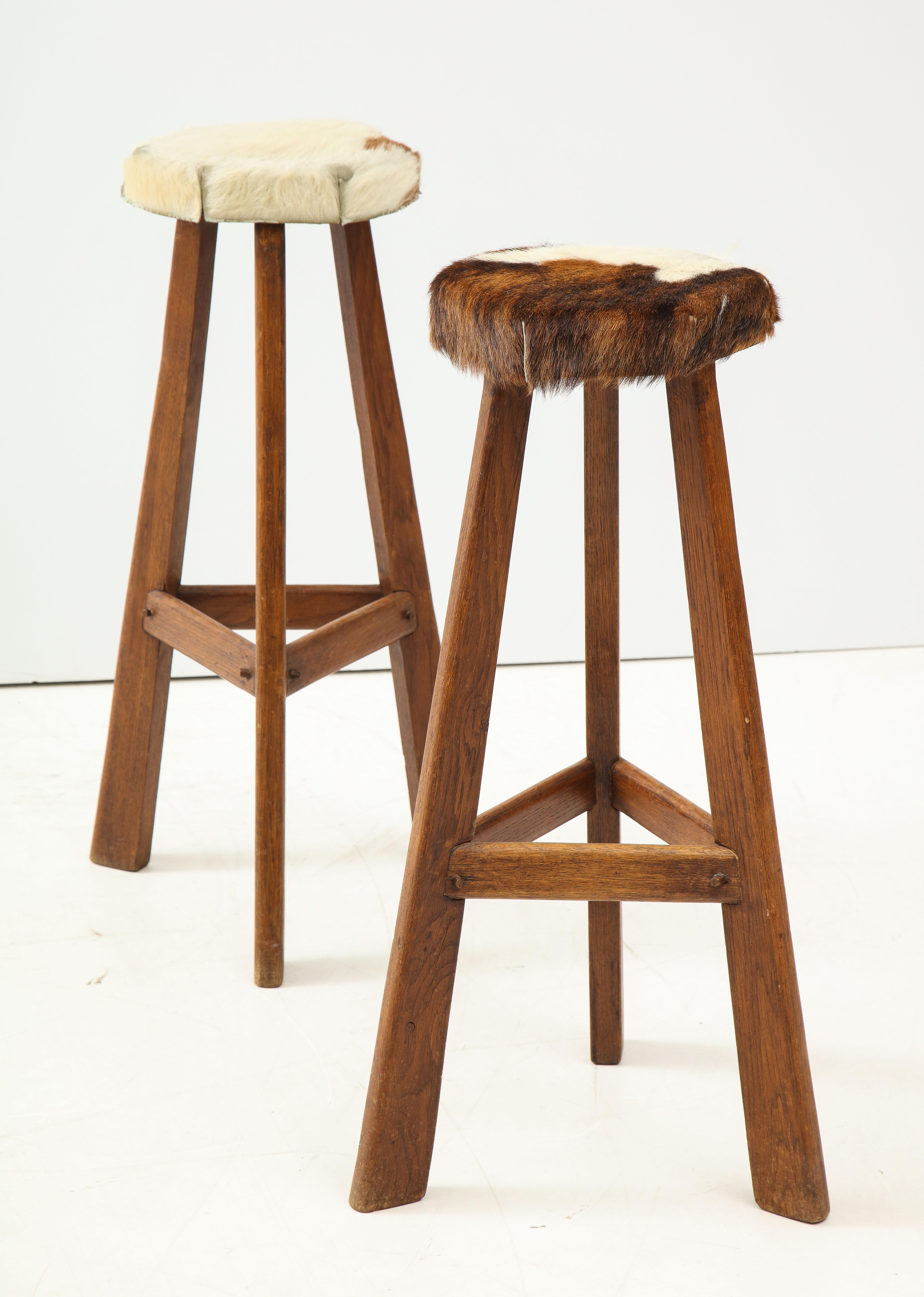 Pair of Midcentury Stools with Cowhide Seats, France, circa 1960 In Excellent Condition For Sale In New York City, NY