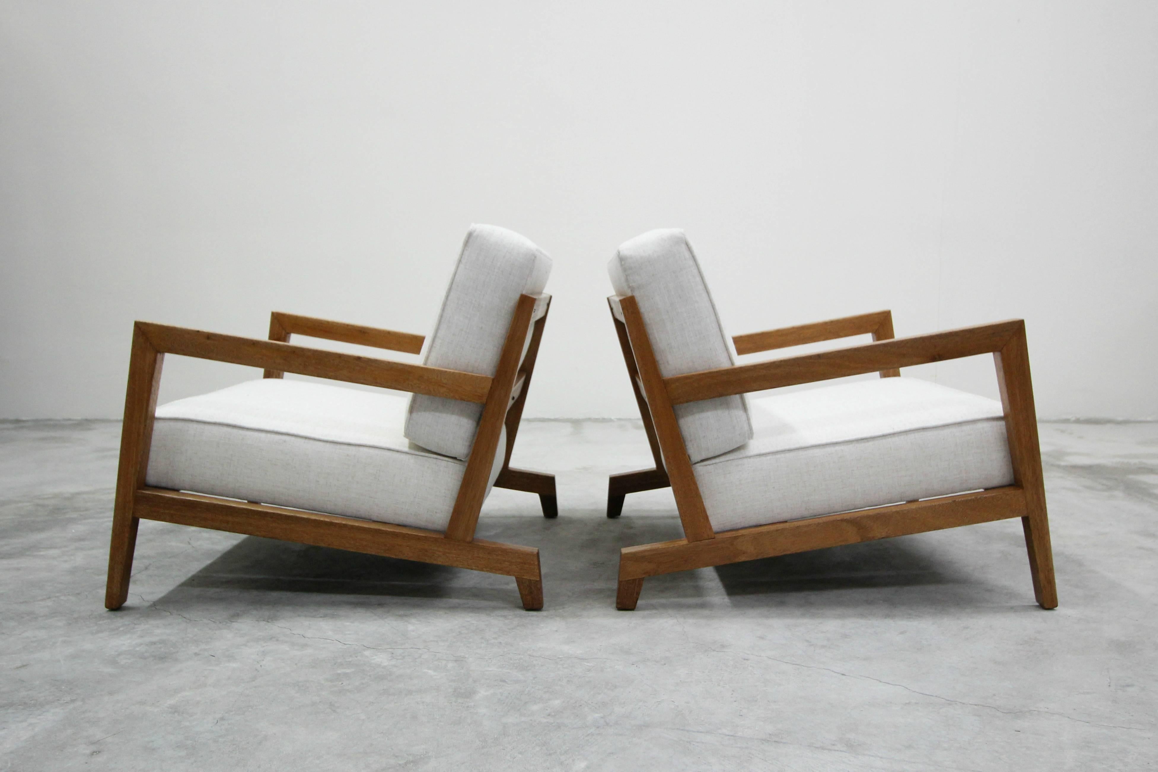 This is an absolutely gorgeous pair of midcentury craftsman lounge chairs. Constructed of solid wood with a very minimal but artistic profile. Probably handcrafted in the 1950s this pair of chairs has lots of character in their details. The