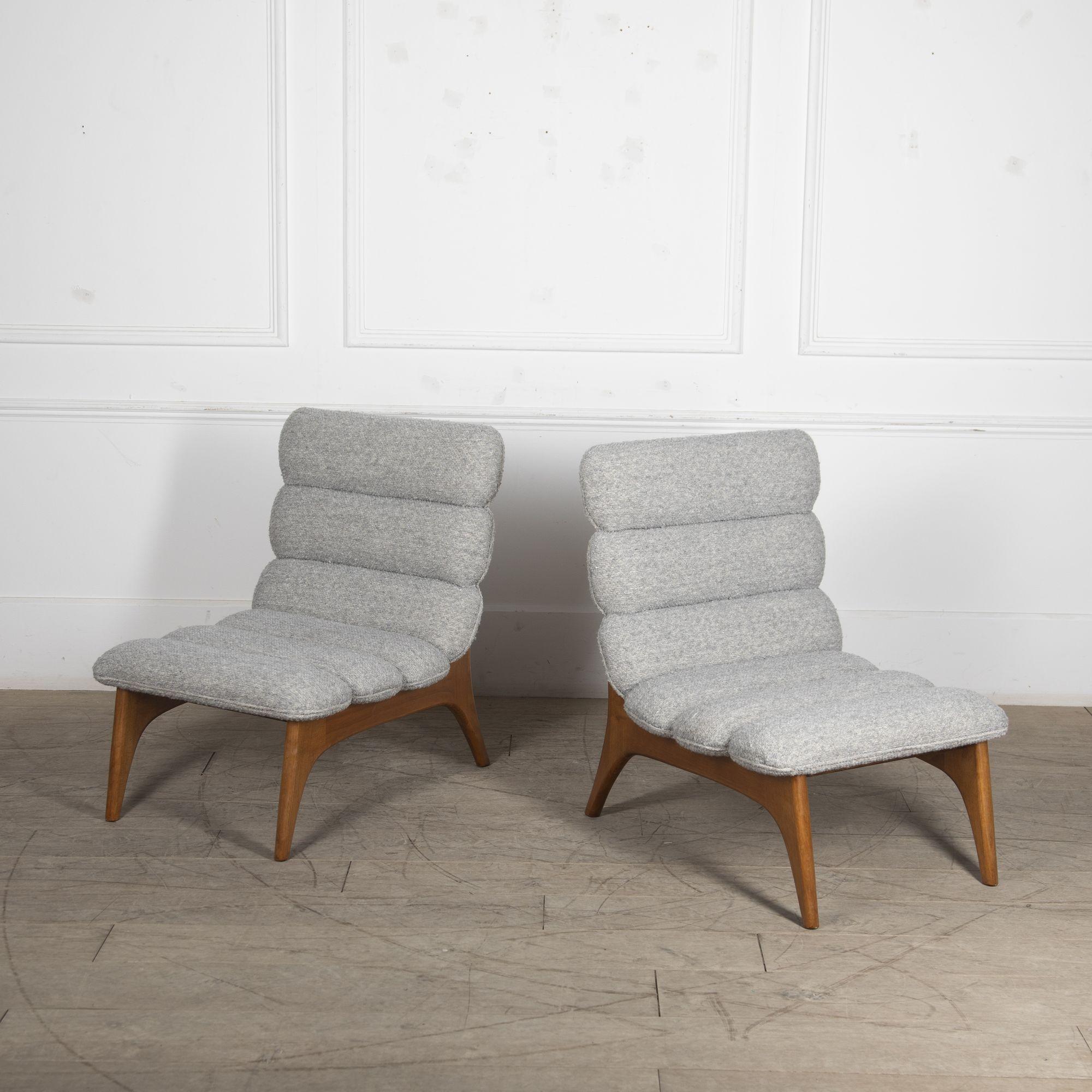 Italian mid-century style contemporary armchairs.
With a gorgeous beech frame and light grey boucle upholstery.
This gorgeous pair of modern armchairs would look fabulous in any living space.
