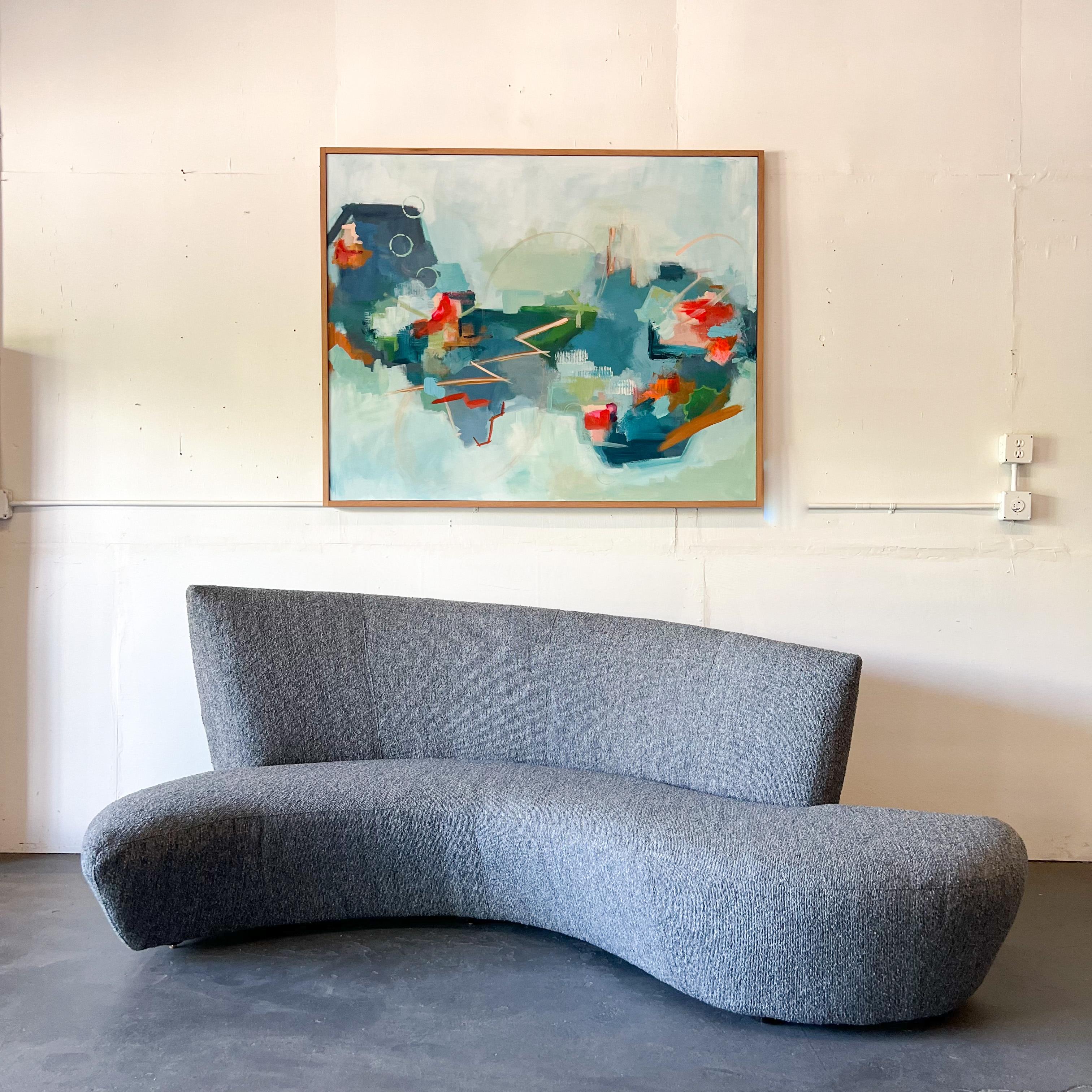 Pair of Mid-Century Modern style Bilbao Serpentine sofas designed after Vladimir Kagan and inspired by the curves and undulations of the Guggenheim Museum in Bilbao Spain. These sofas have new blue/grey tweed upholstery and self-leveling feet.