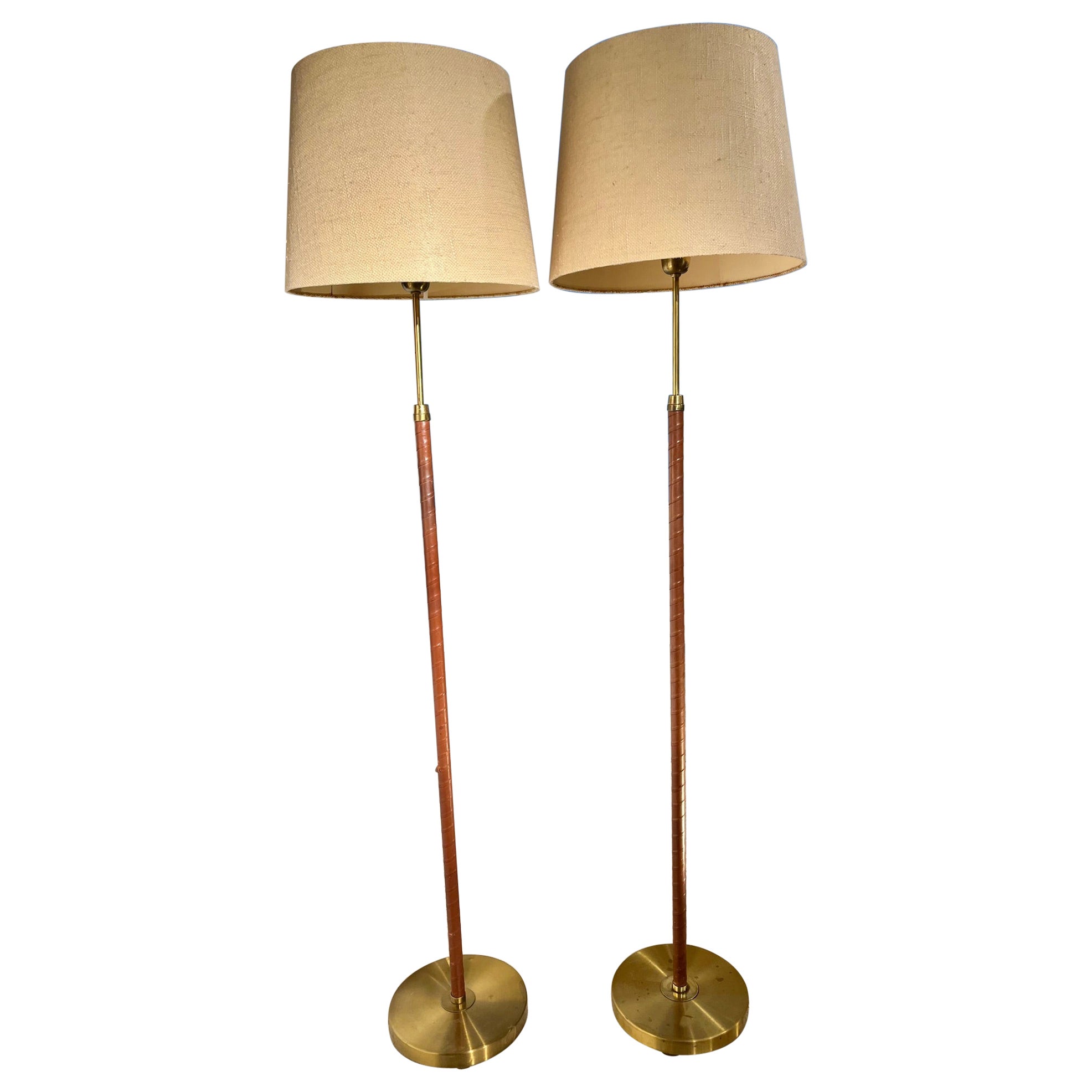 Pair of Mid-Century Sweden Brass and Leather Floor Lamps by Einar Bäckström. For Sale