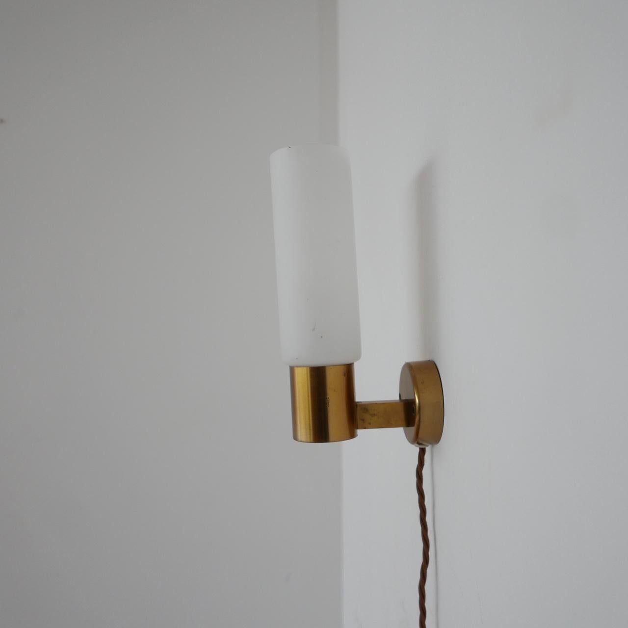 A pair of midcentury wall lights. 

Sweden, c1970s. 

Re-wired with gold silk flex. 

Brass gallery with sandblasted glass shades. 

Price is for the pair. 

Dimensions: 22 H x 7 W x 12.5 D in cm.
  