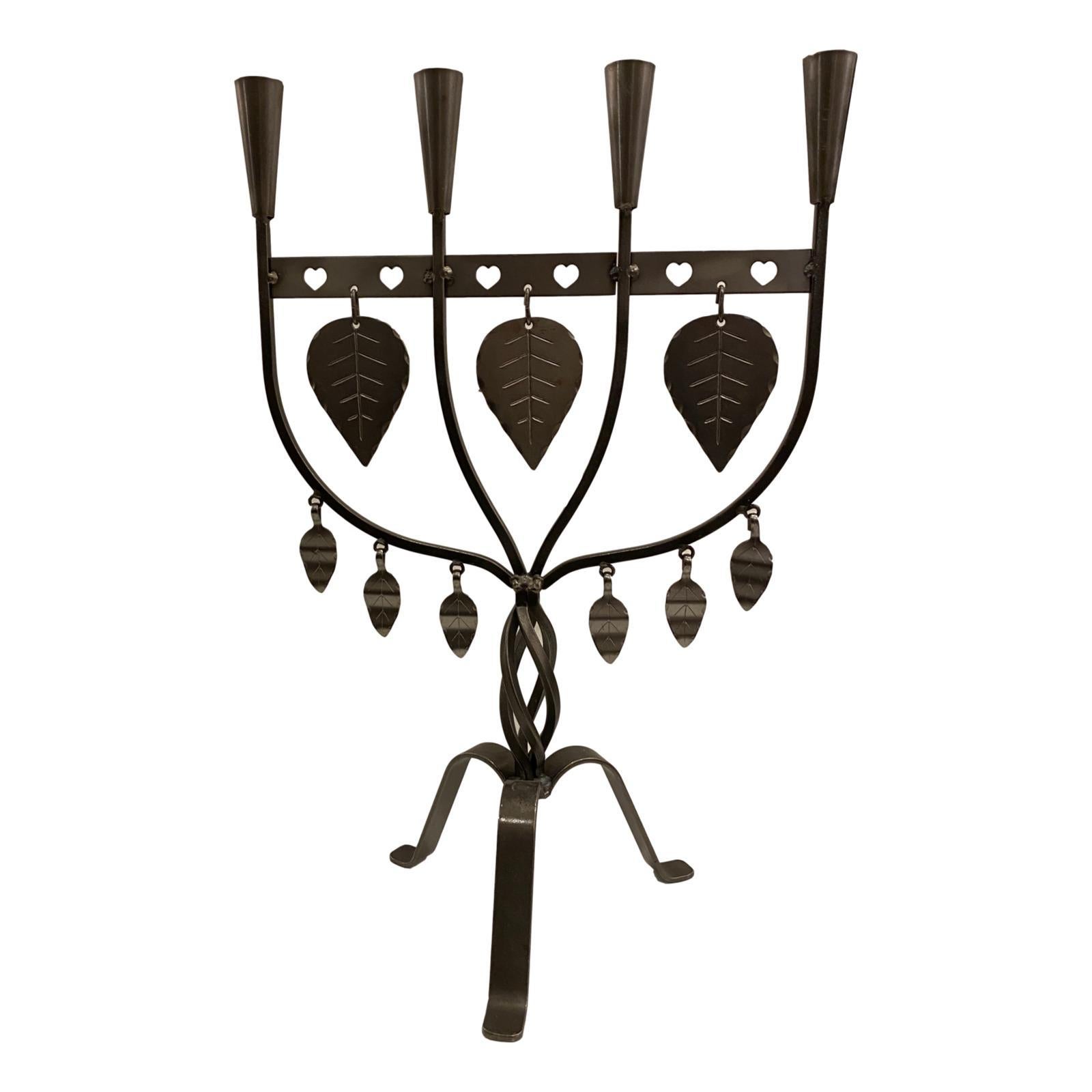 A pair of circa 1960s Swedish wrought iron candelabras.

Measurements:
Height of body 18.75