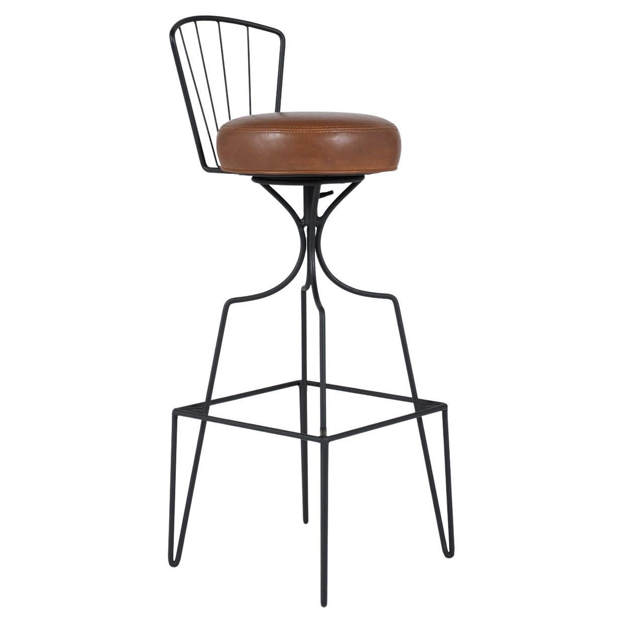 Introducing our expertly restored pair of 1960s Mid-Century Modern Swivel Leather Bar Stools. Celebrate timeless elegance with these high stools that come in impeccable condition. Showcasing round seat cushions, these stools are freshly upholstered