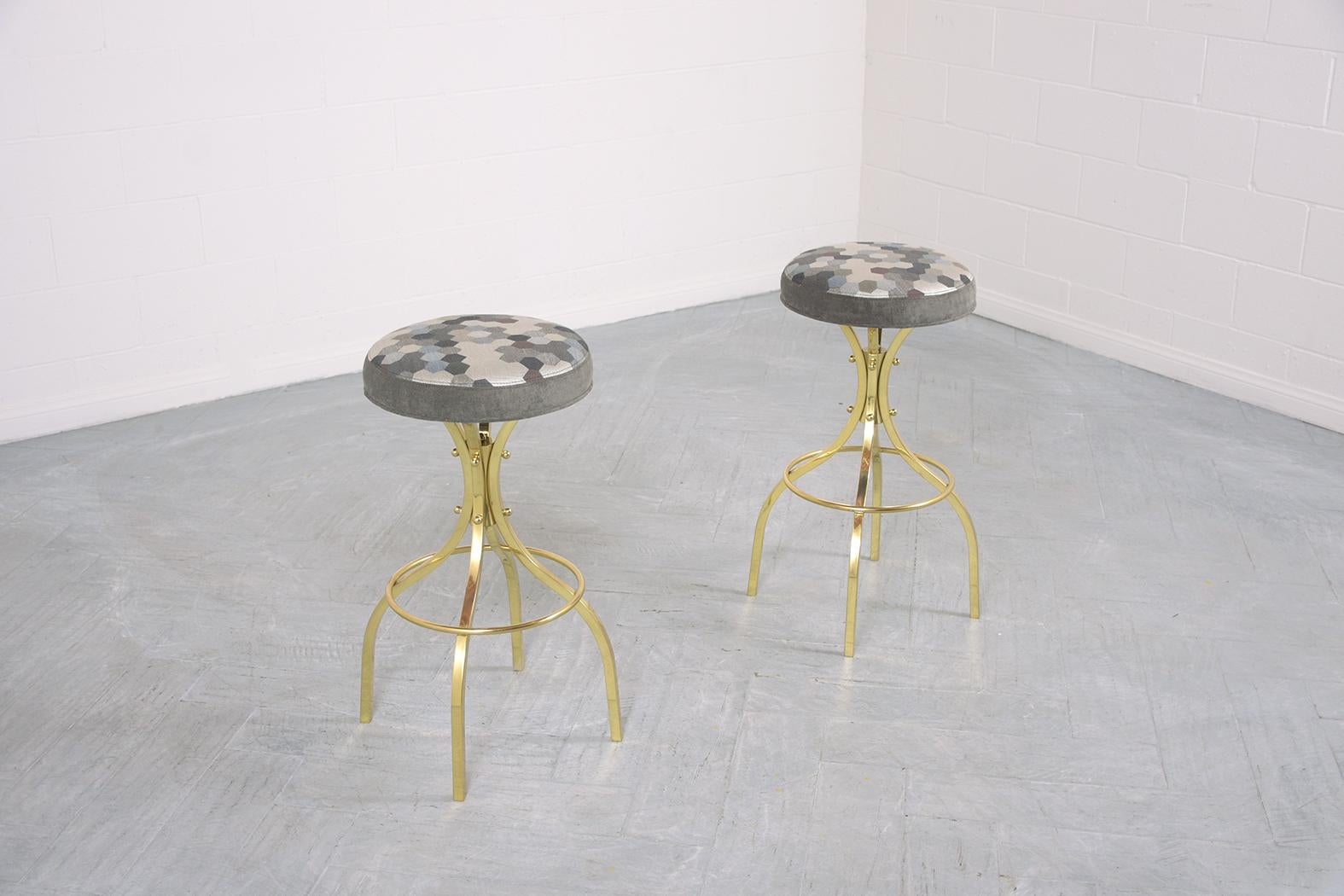 Polished Restored Mid-Century Brass Swivel Bar Stools with Patterned Fabric Seats For Sale
