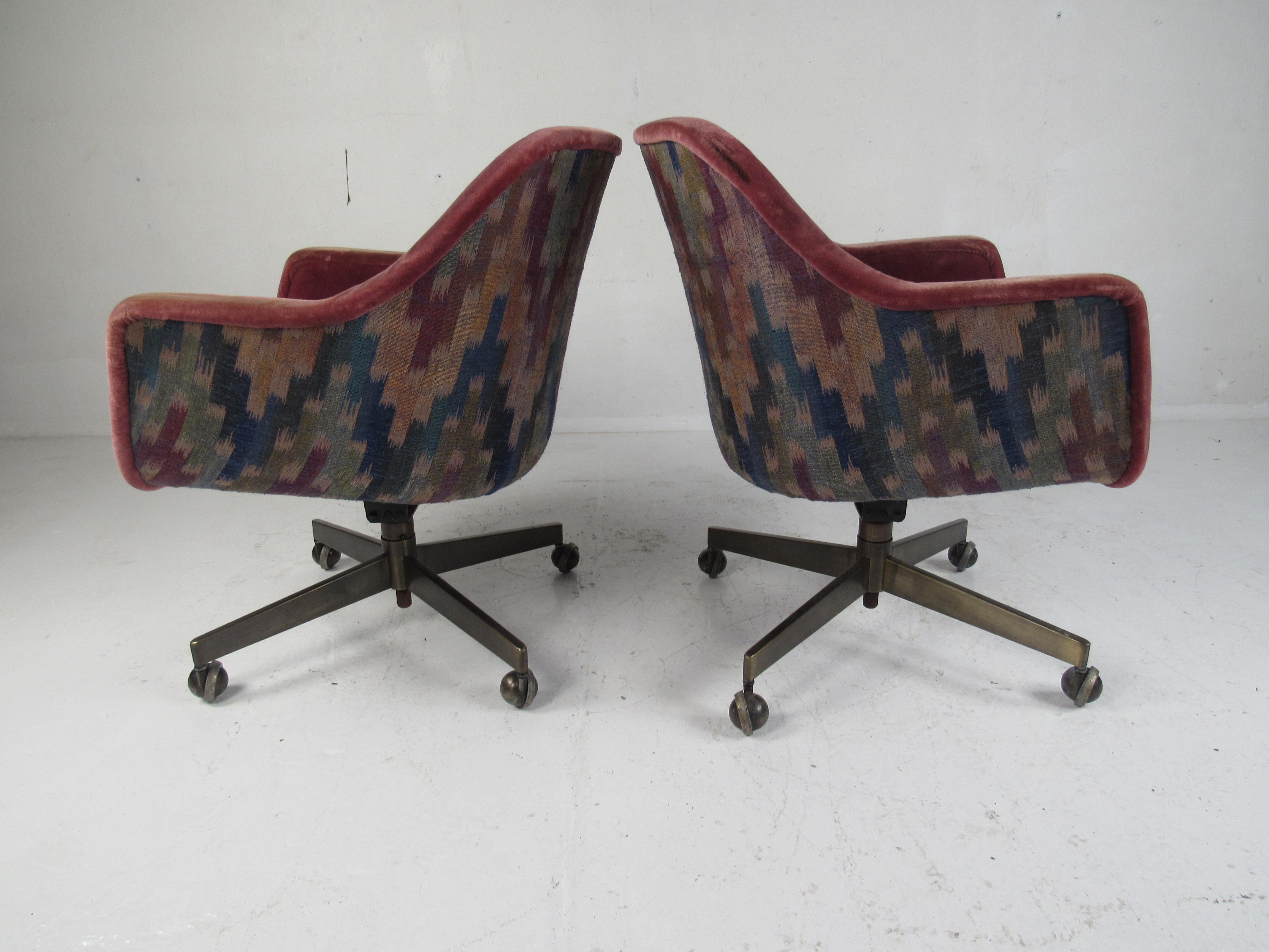 This stylish pair of vintage desk chairs by Barrit Furniture boast swivel metal bases and comfortable bucket style seats. A sleek design with plush upholstery adding to the midcentury appeal. Please confirm item location (NY or NJ).