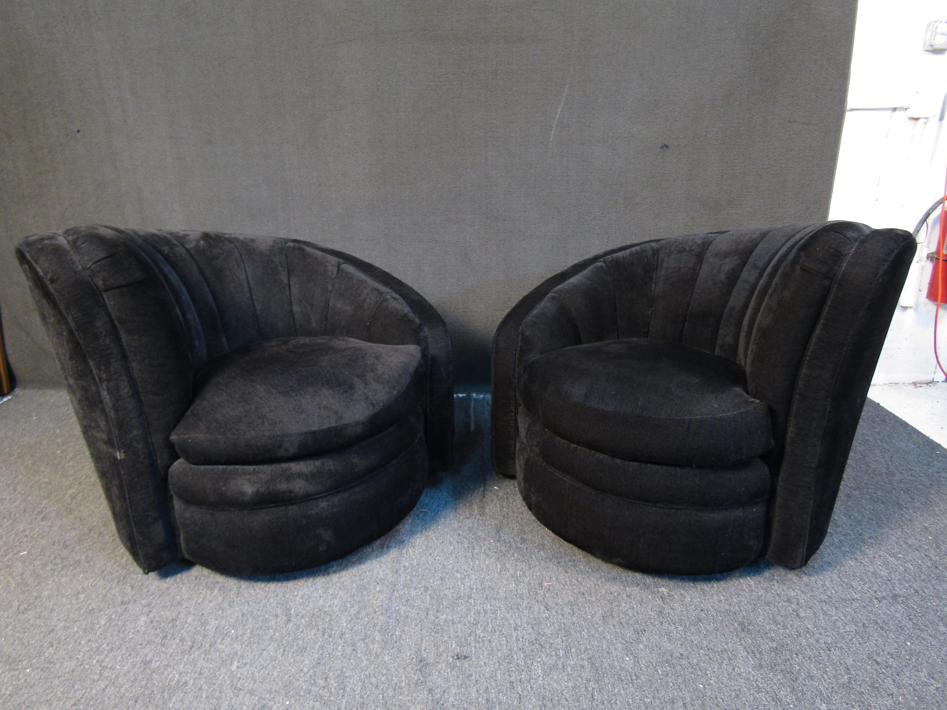Unique spiral back swiveling lounge chairs featuring dark upholstery and a mid-century modern look. Please confirm item location with seller (NY/NJ).