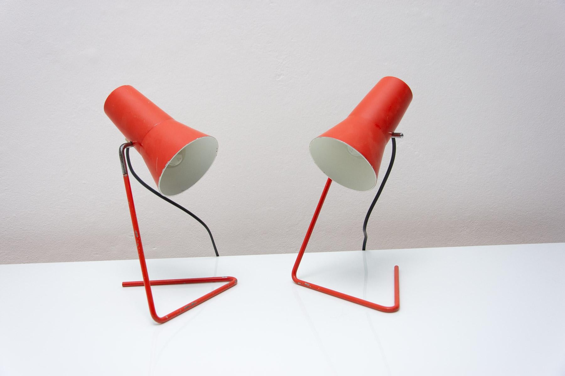 These mid century table lamps designed by Josef Hurka for Napako will complement mid century or vintage furniture from our offer.

It features a curved structure to which a red cone-shaped shade is attached. Other material: aluminum, plastic. Fully