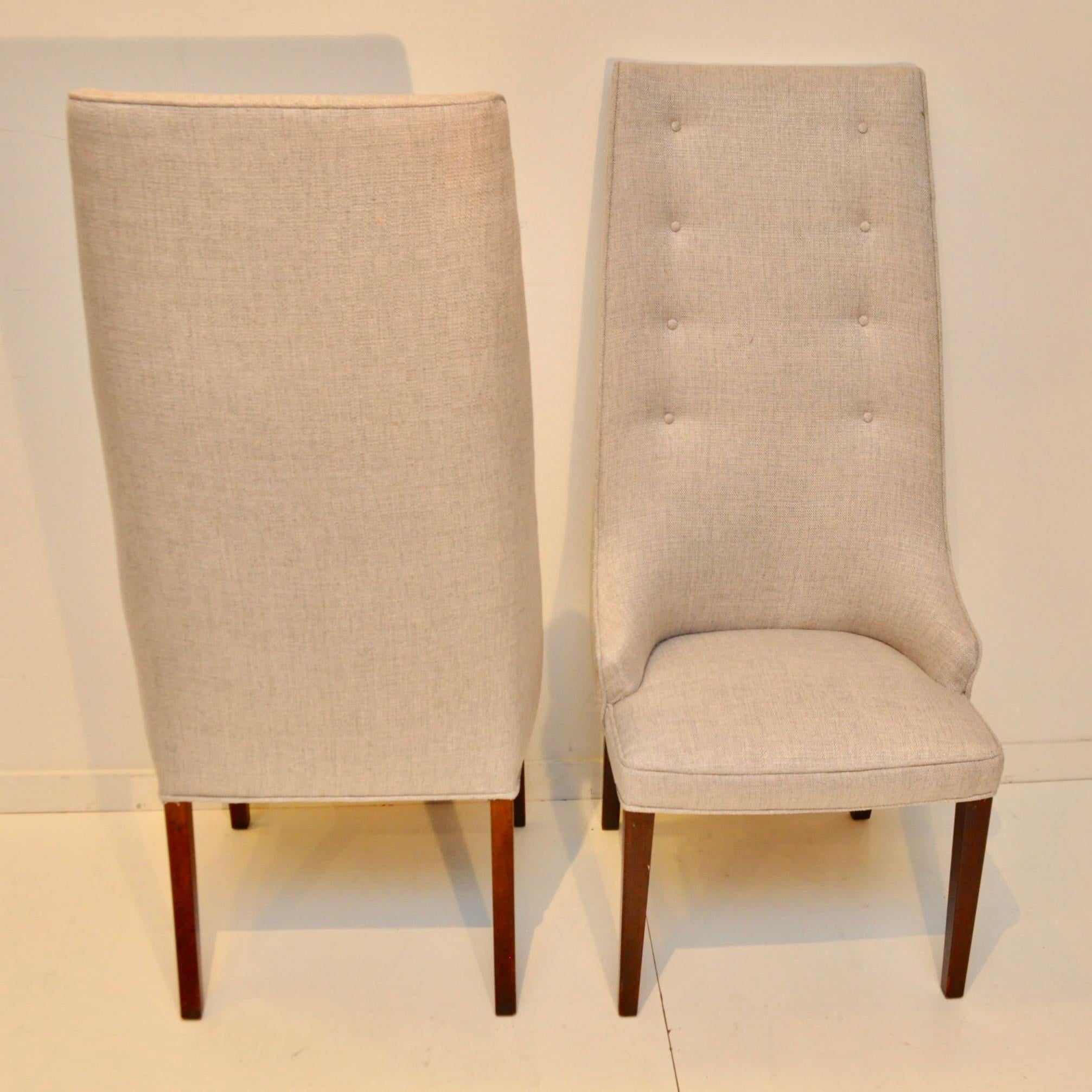 Selling three sets of two tall back, newly upholstered, dining chairs from the 1950s. The previous upholsters label had a date of 1966. On each leg, by the seat base, is stamped Denmark. These would make great end of table chairs. Fabric is a light