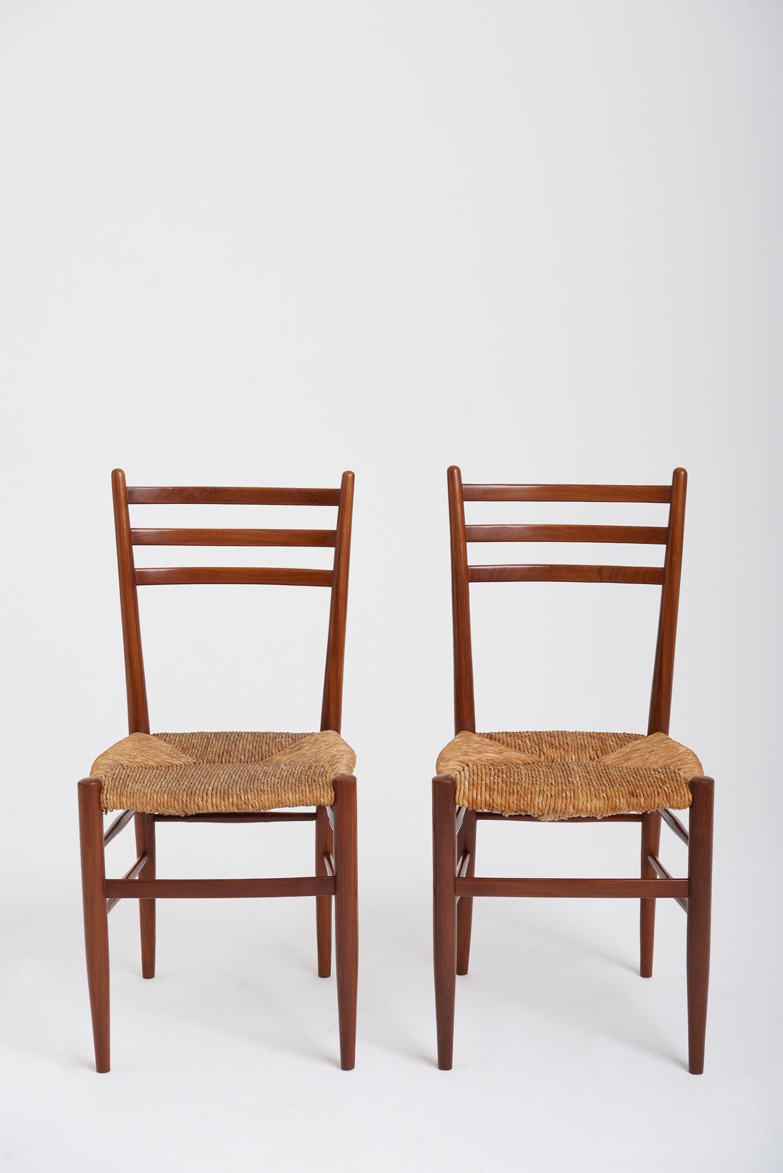 A pair of midcentury teak and rush seat ladder back chairs designed by Otto Gerdau.
Retailed by Rooksmoor Mills, in their Knightsbridge showroom in London (Beauchamp Place).
Bearing the original retailer's label.
Italy, third quarter of the 20th
