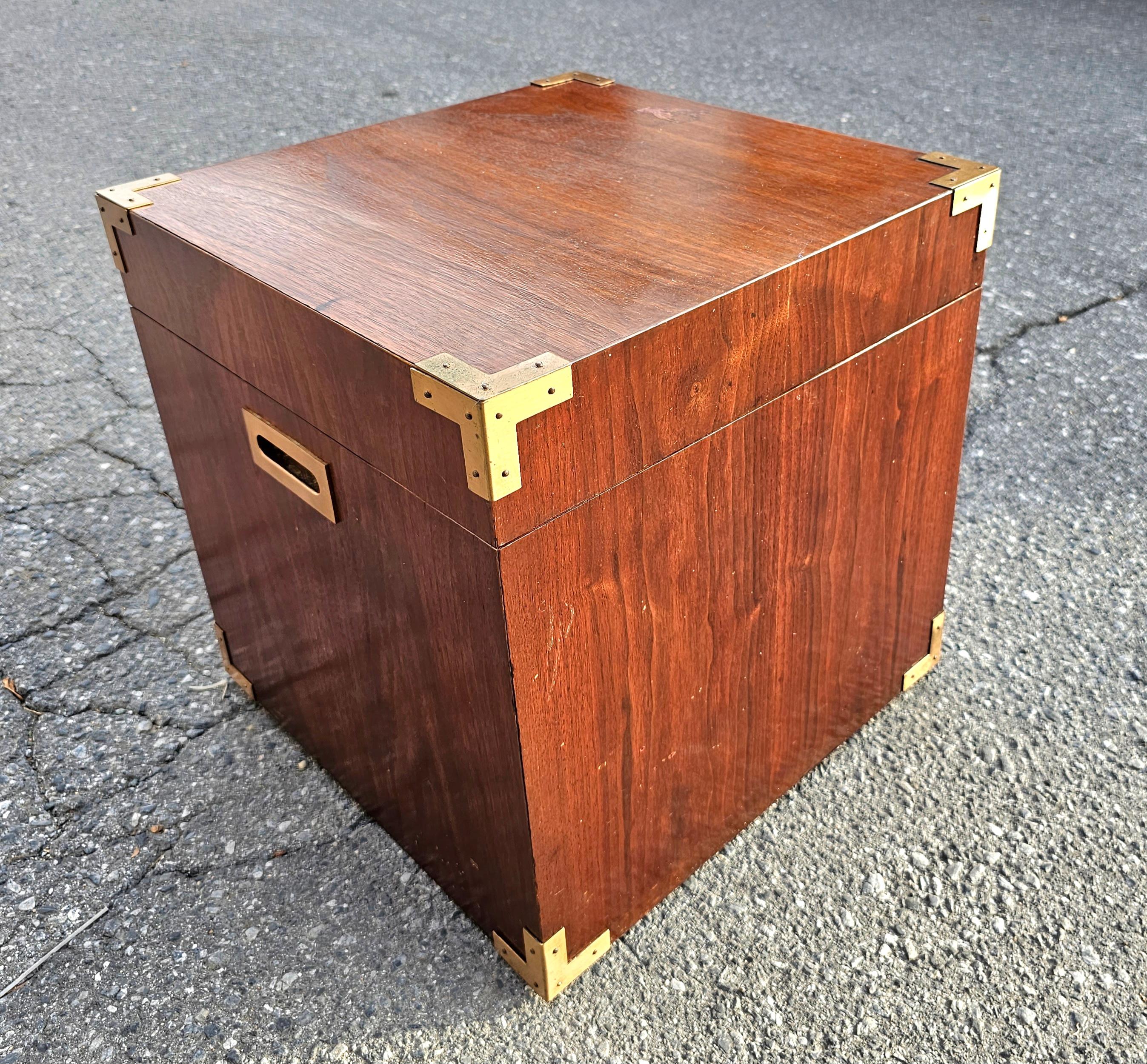 A very unique Pair of Mid Century Teak Campaign Style Cubical Side Tables Chests. Measure 17