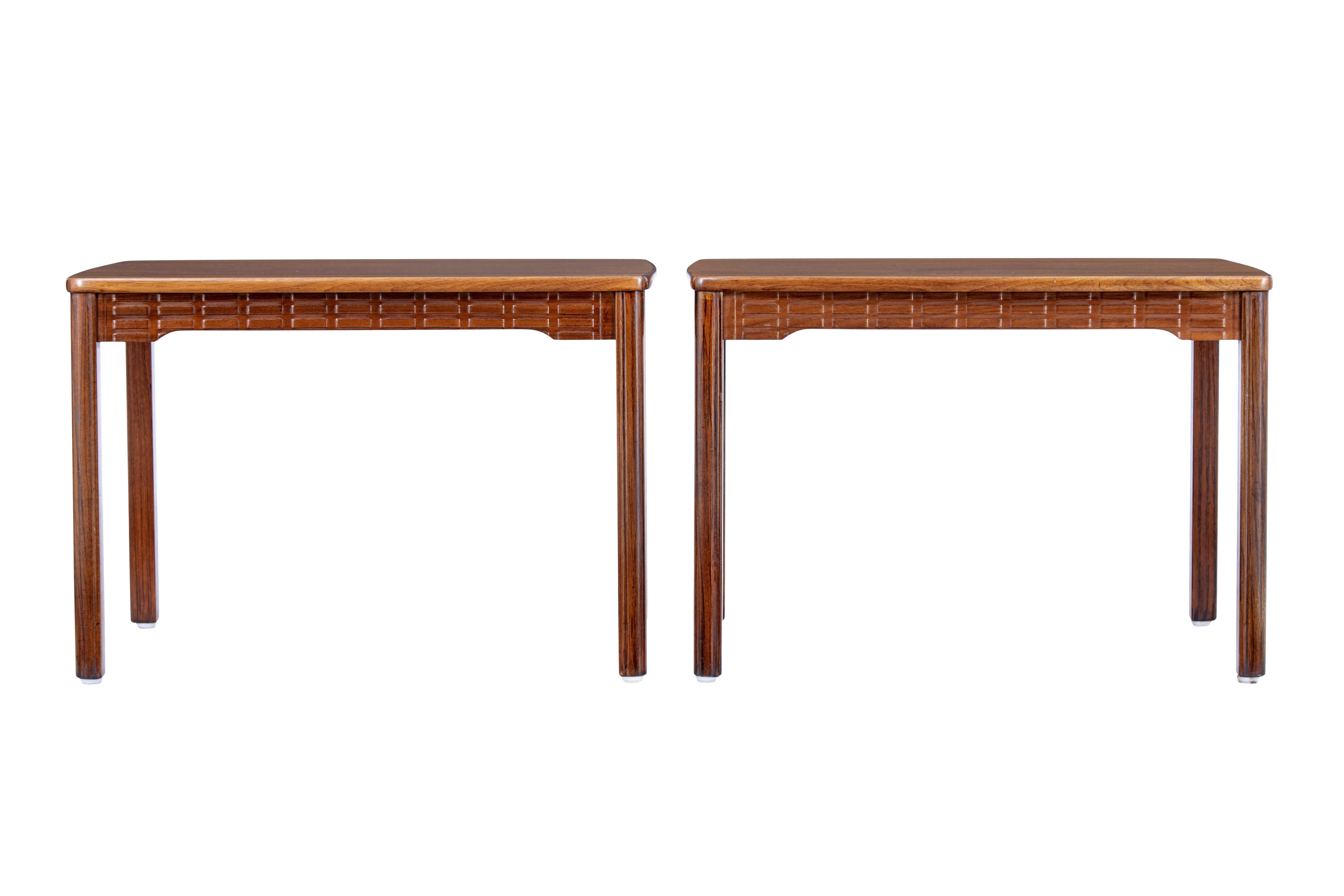 Pair of mid century teak side tables circa 1960.

Pair of scandinavian teak side tables, ideal for being either end of the sofa, or many possibilities around the home.

Richly coloured rectangular tops with slightly rounded edges.  Carved frieze