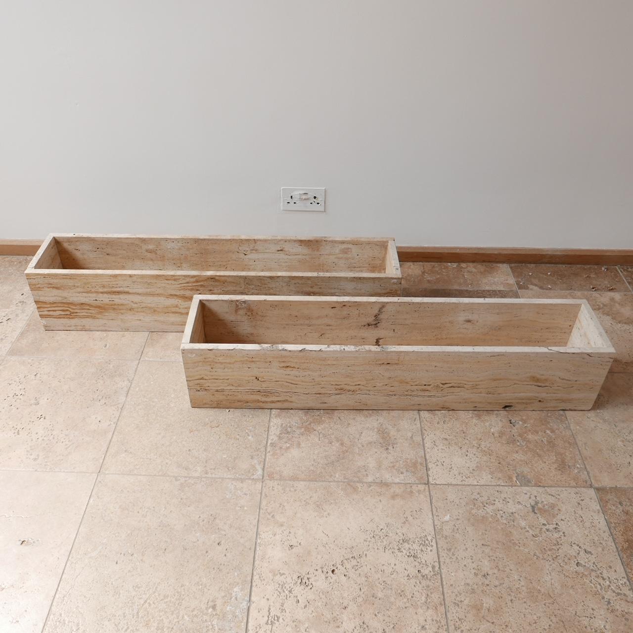 A pair of stylish travertine planters.

Belgium, c1970s.

Solid travertine construction.

Good condition, one or two chips commensurate with age.

Price is for the pair.

Location: London Gallery.

Dimensions: 110 W x 22 D x 22 H in cm.

Delivery: