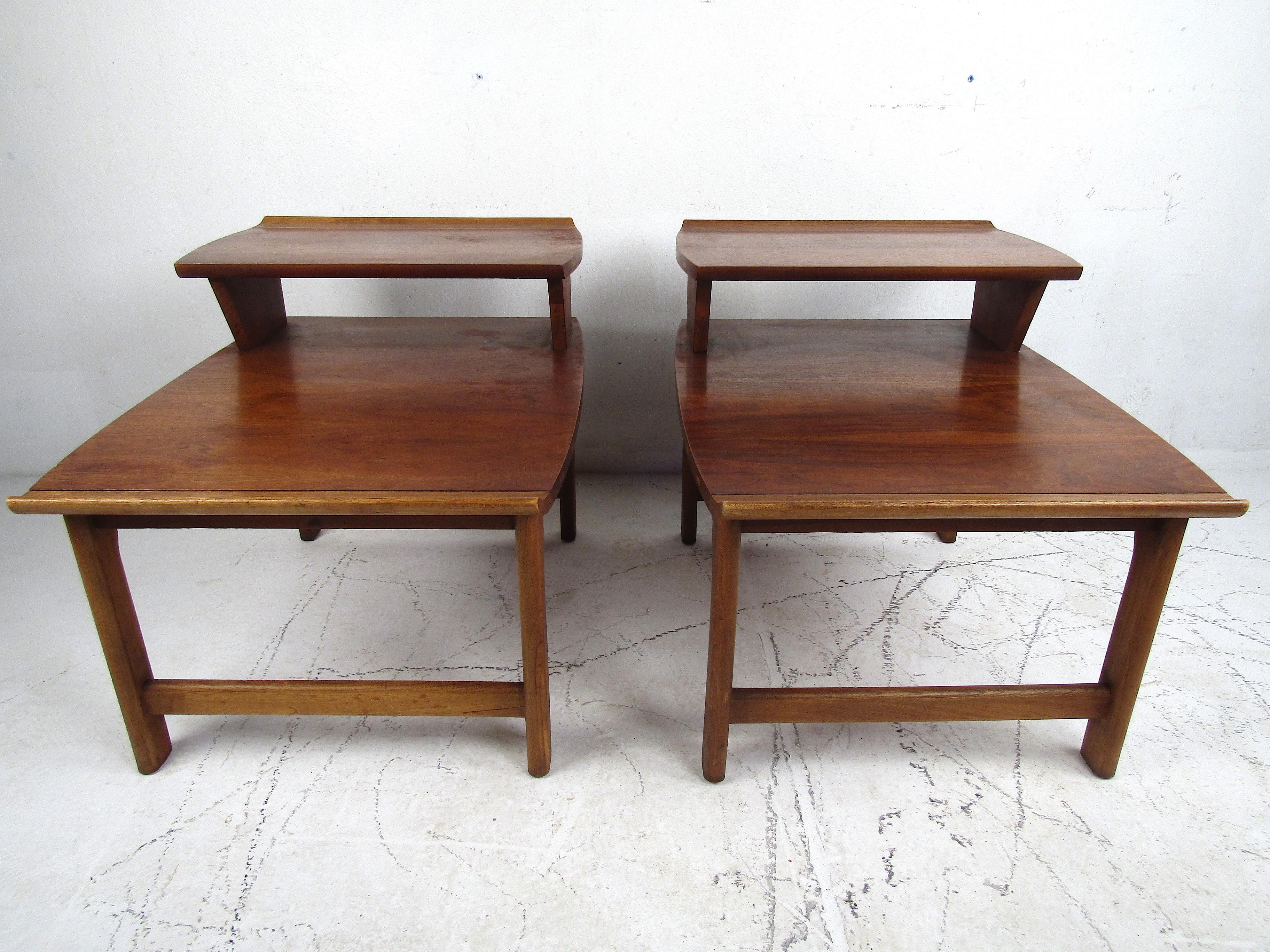 Stylish pair of Mid-Century Modern side tables manufactured by Lane Furniture Co., circa 1965. Sturdy design with interesting joinery and accents across the sides of the tables. Sure to complement and modern interior. Please confirm item location