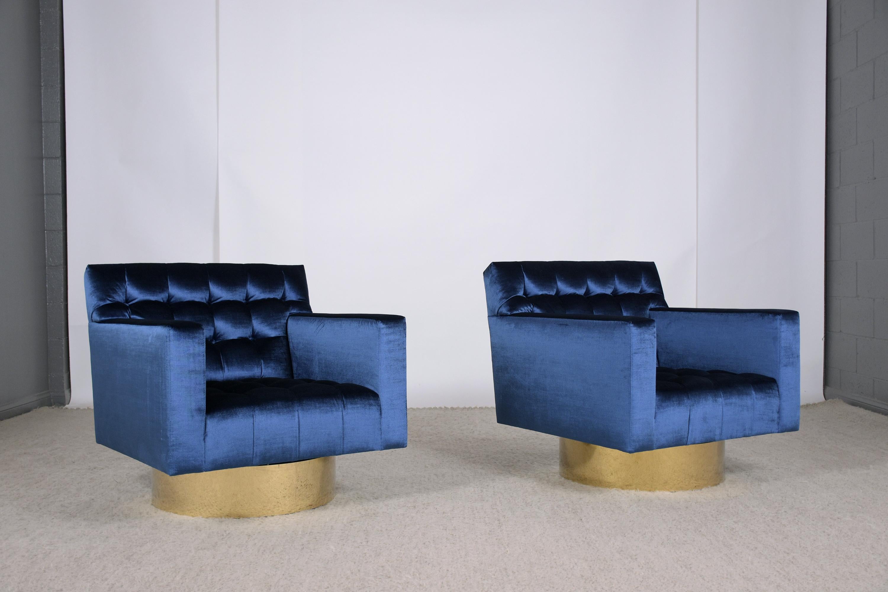 Polished 1960s Blue Velvet Mid-Century Modern Swivel Lounge Chairs with Brass Bases For Sale