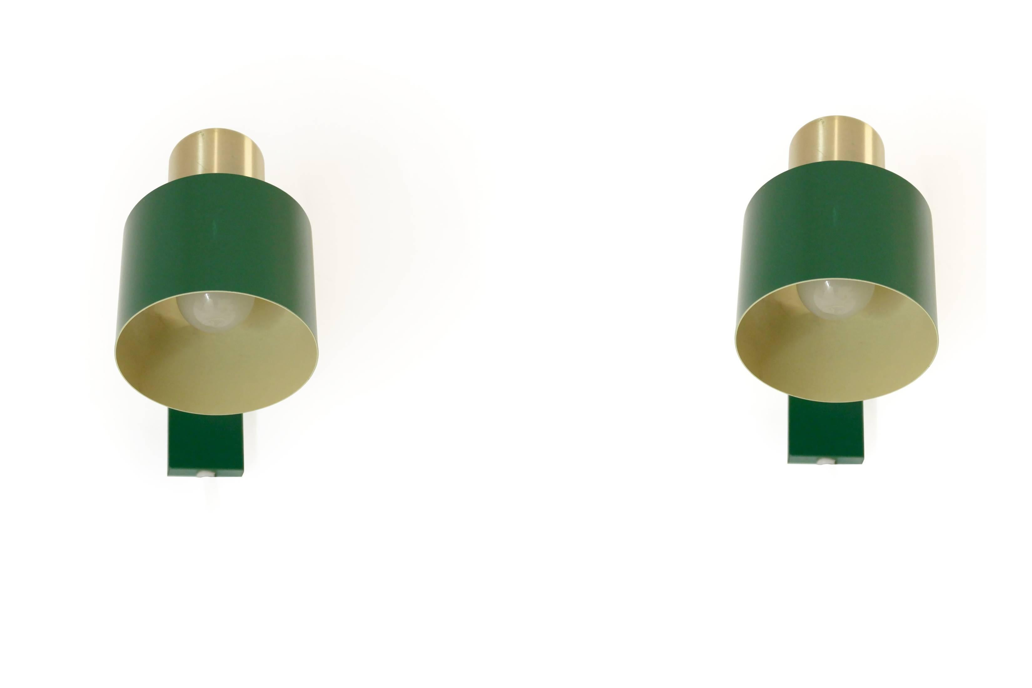 Pair of iconic Danish wall lights in painted steel and brass. This is model 'Alfa'. Designed by Jo Hammerborg and made in Denmark by Fog & Mørup from circa 1970s first half. Both lamps are fully working and in good vintage condition.