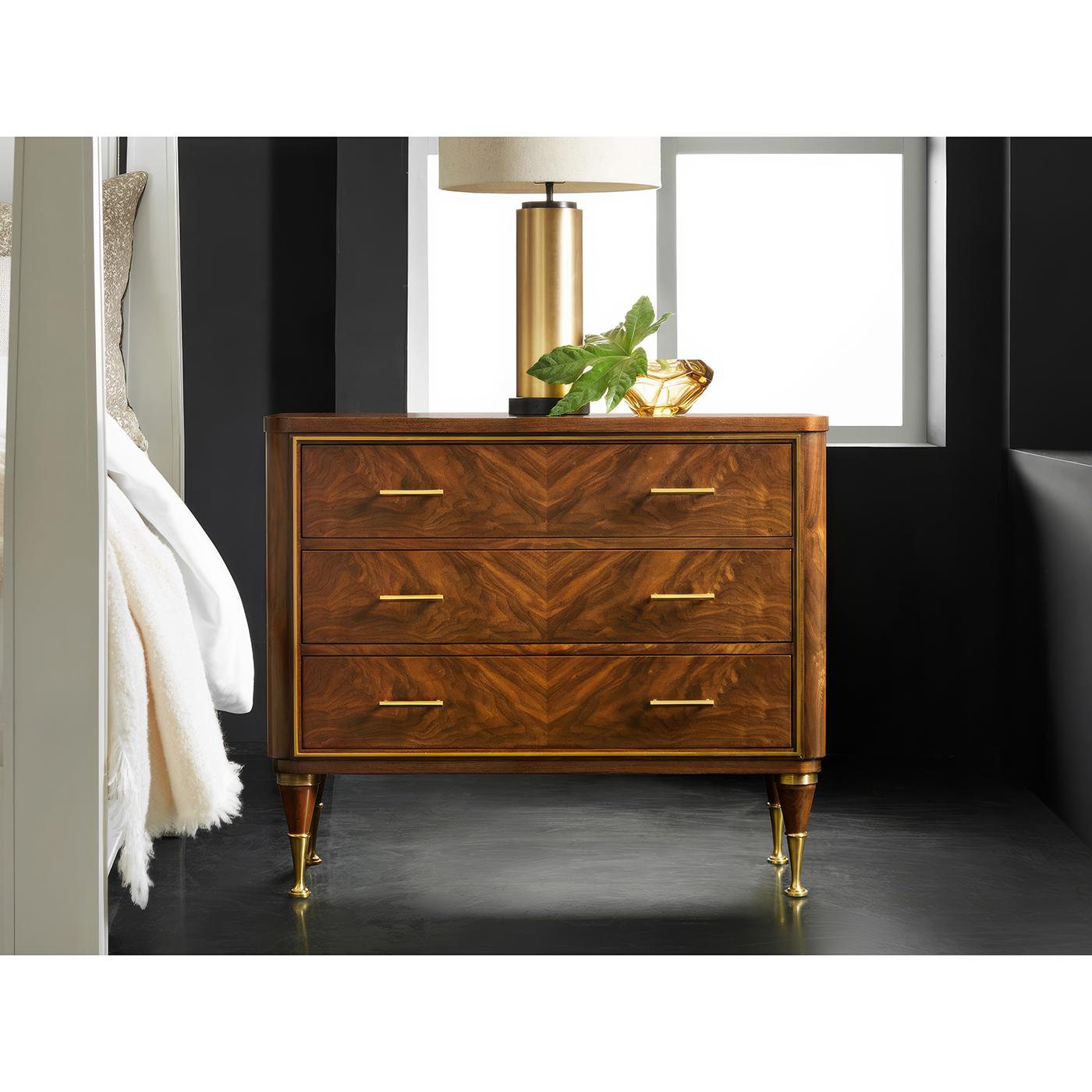 Crafted with hand-rubbed figured walnut veneer, this exquisite piece showcases a rich, natural grain that enhances its timeless appeal. The chest features three spacious oak dovetailed soft-closing drawers, ensuring durability and impeccable