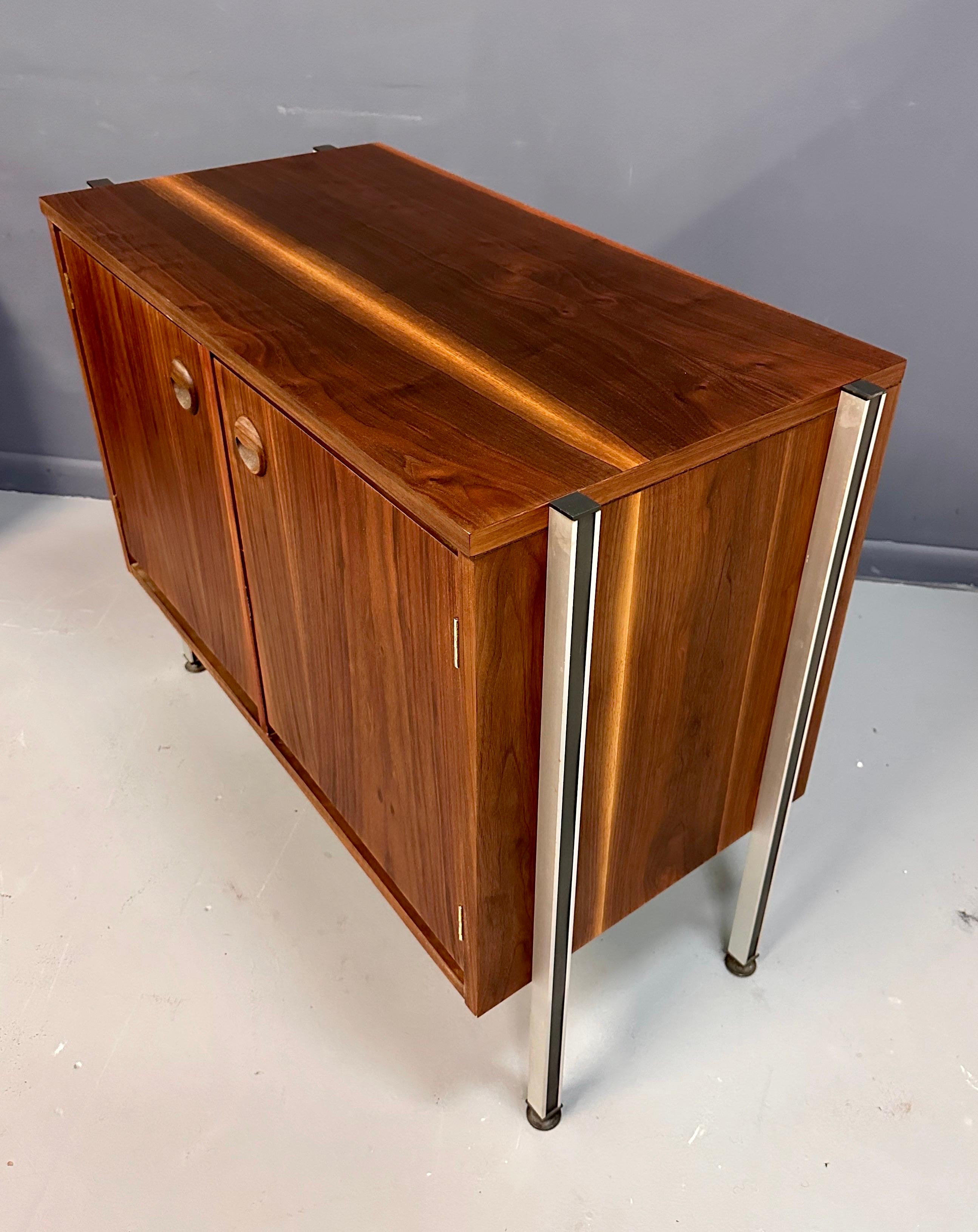 North American Pair of Midcentury Walnut Cabinets with Exposed Aluminum Legs Style of Wormley For Sale