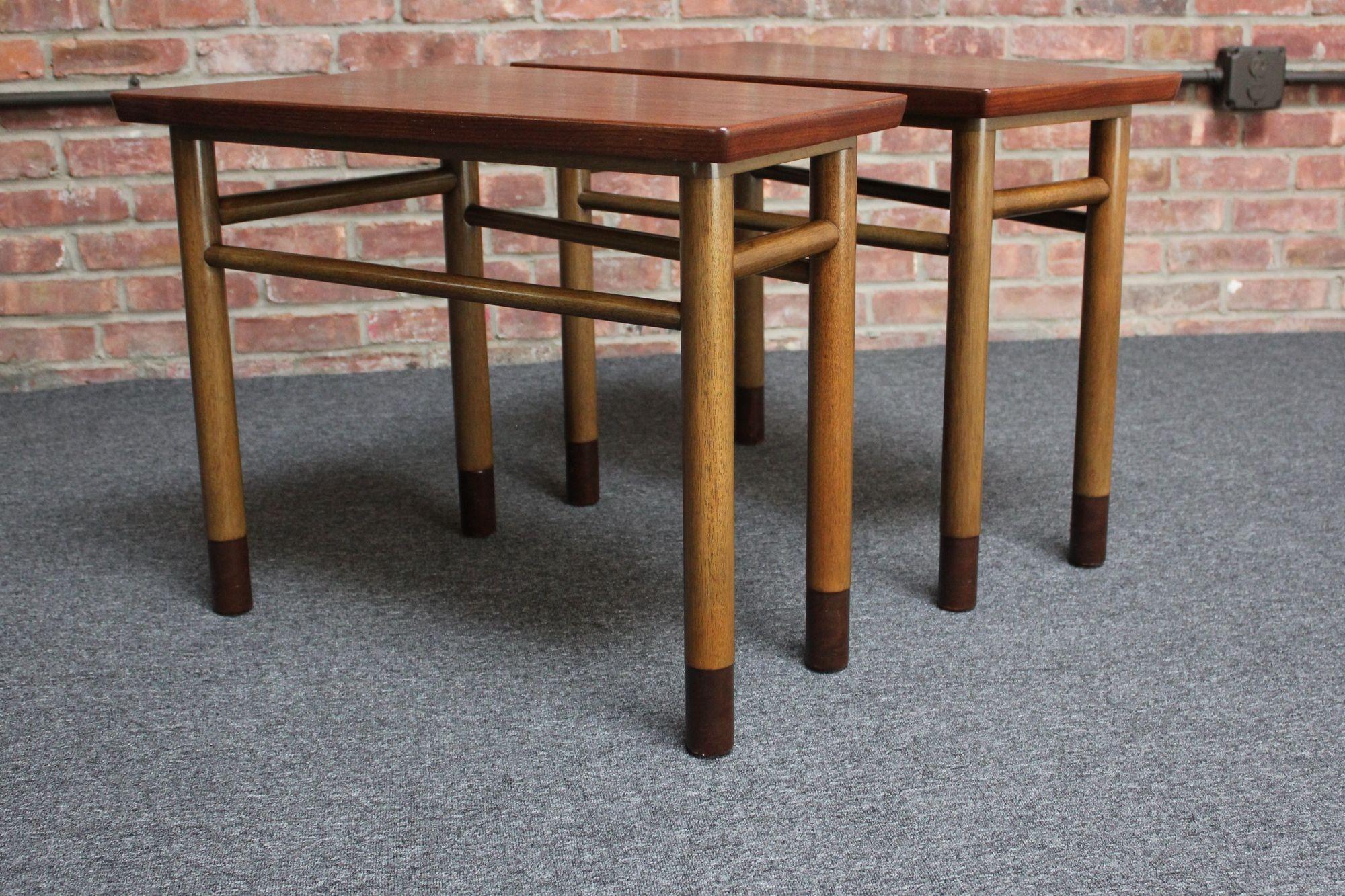 Pair of Edward Wormley for Dunbar walnut wedge/trapezium-form end tables with mahogany stretchers/bases and leather-wrapped feet (model #5216, ca. 1955, Indiana, USA).
Uncommon examples given the table shape and materials employed.
Conservatively