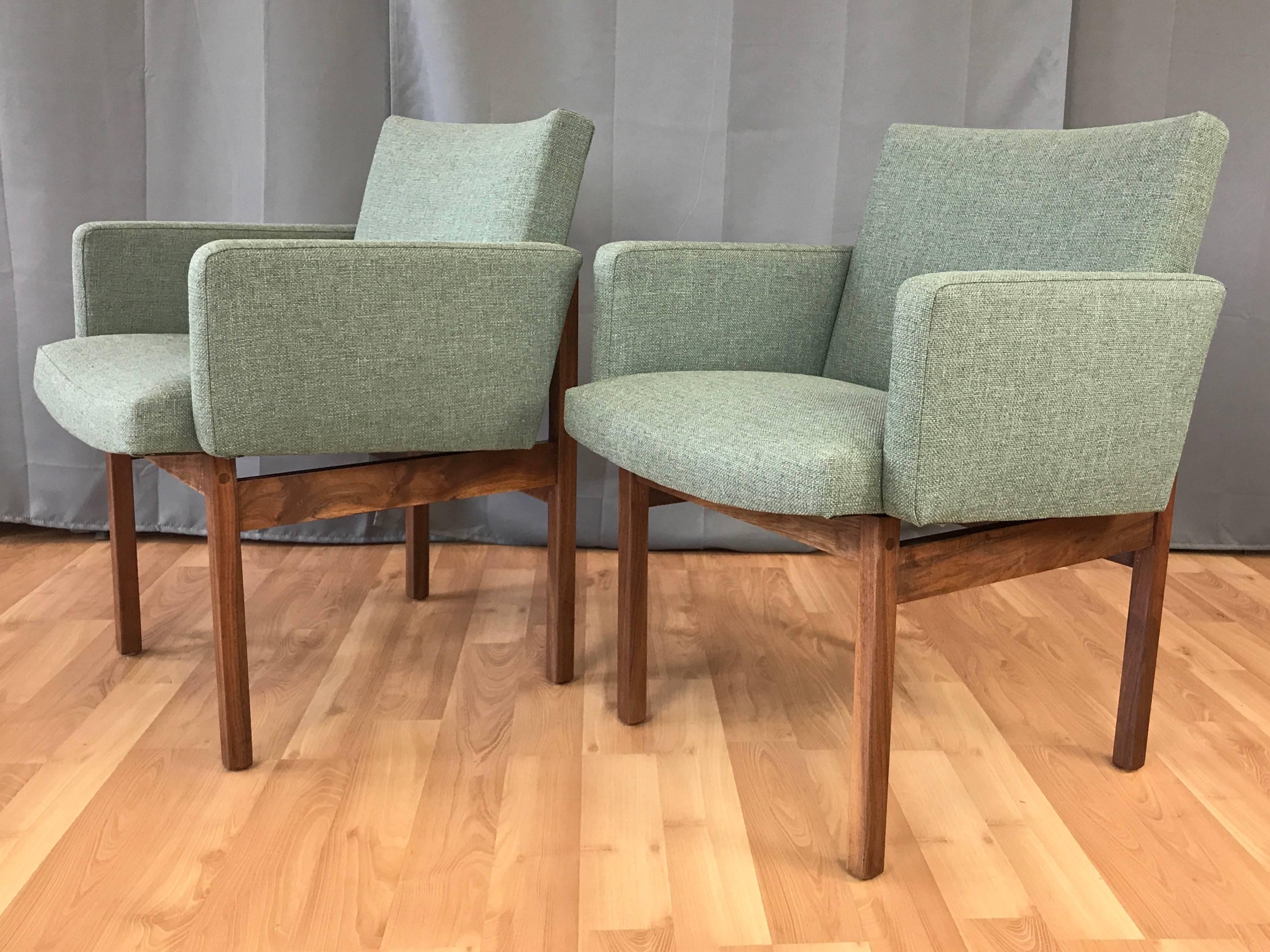 A very handsome pair of midcentury walnut lounge chairs attributed to Jens Risom.

Exceptionally well-crafted solid walnut frame, with crosspieces shaped to perfectly cradle the seat’s gentle curves within its straight, geometric lines. Seat has