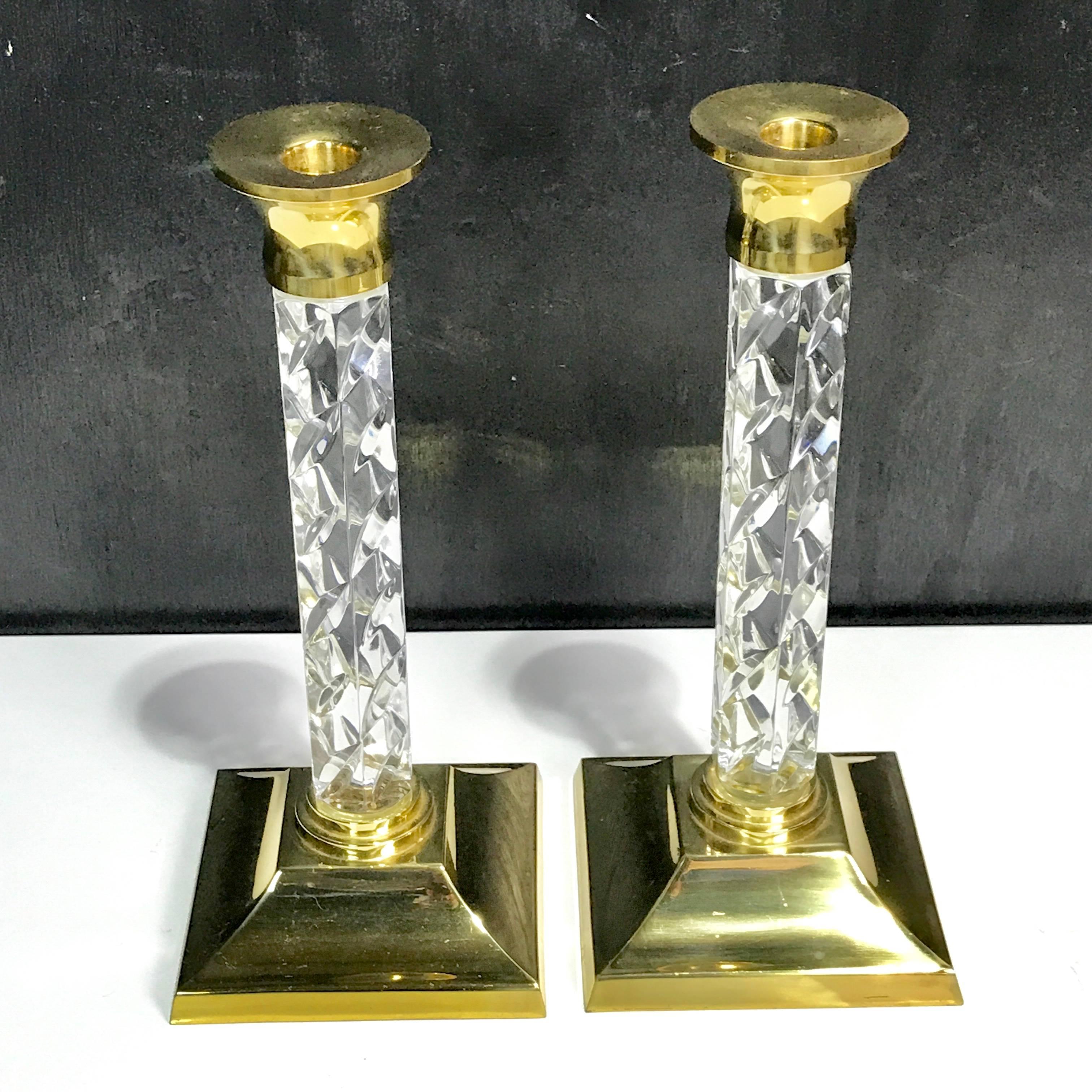 Pair of midcentury waterford crystal and brass candlesticks.
