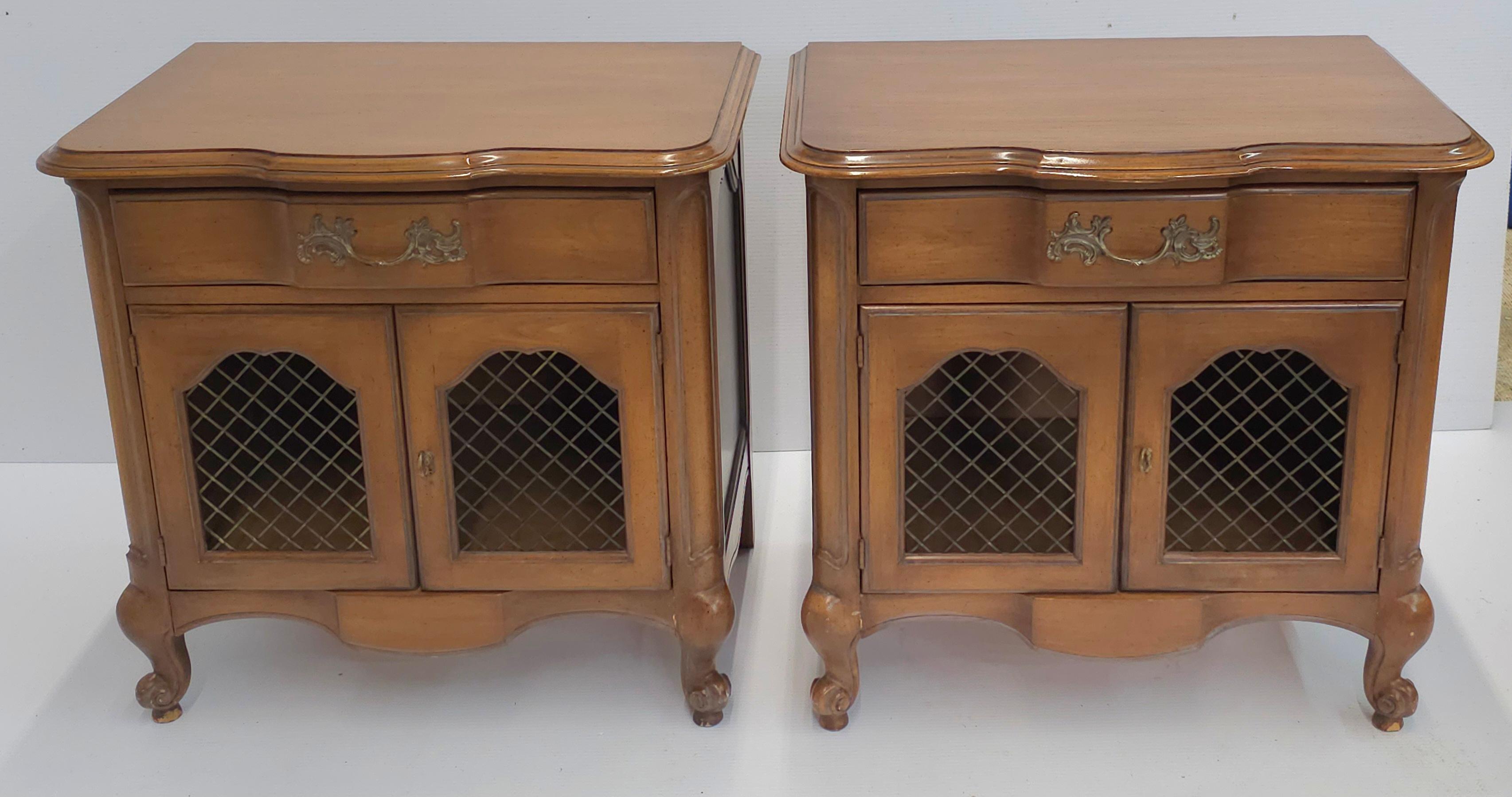 A Pair of Mid-Century White Furniture Provincial style Walnut and Wire mesh Bedside Tables. Measures 27