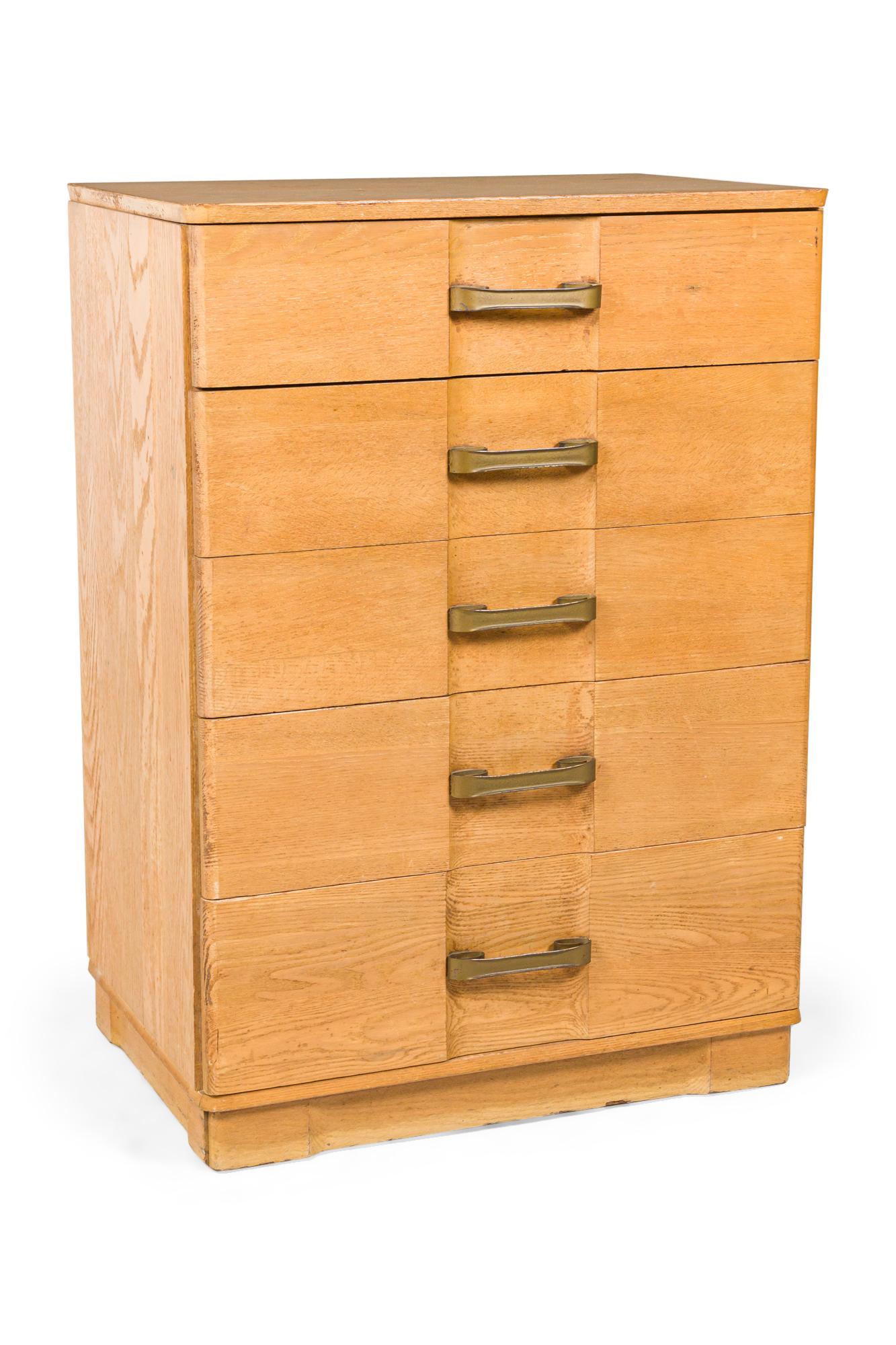 Pair of mid-century white oak Morgan chests with five drawers mounted with scroll design brass drawer pulls. (PRICED AS PAIR)