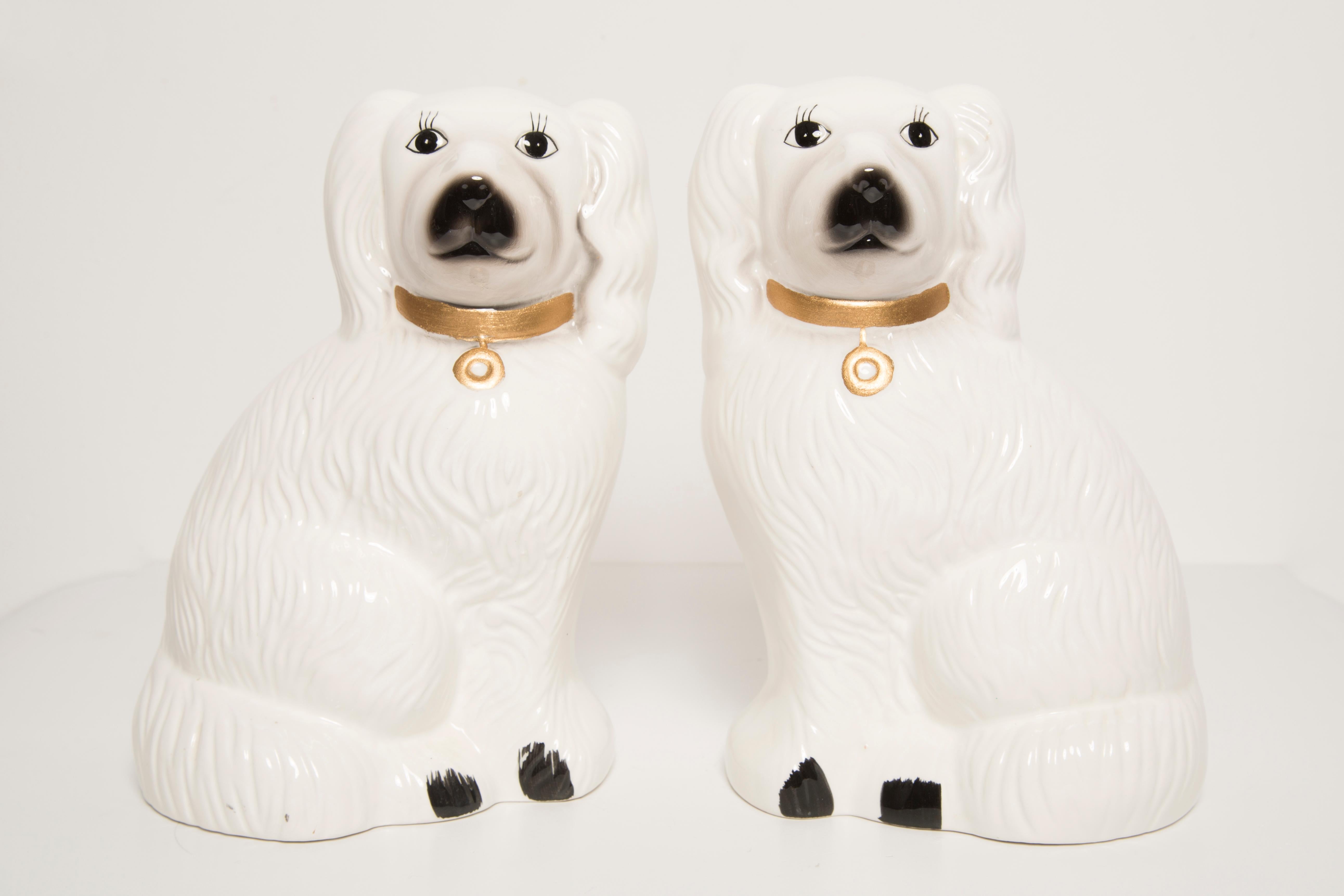 Painted ceramic, good original vintage condition. Beautiful and unique decorative sculptures. White Spaniel Dogs Sculpture was produced in Staffordshire, England in 1960s. Only one pair of dogs are available.