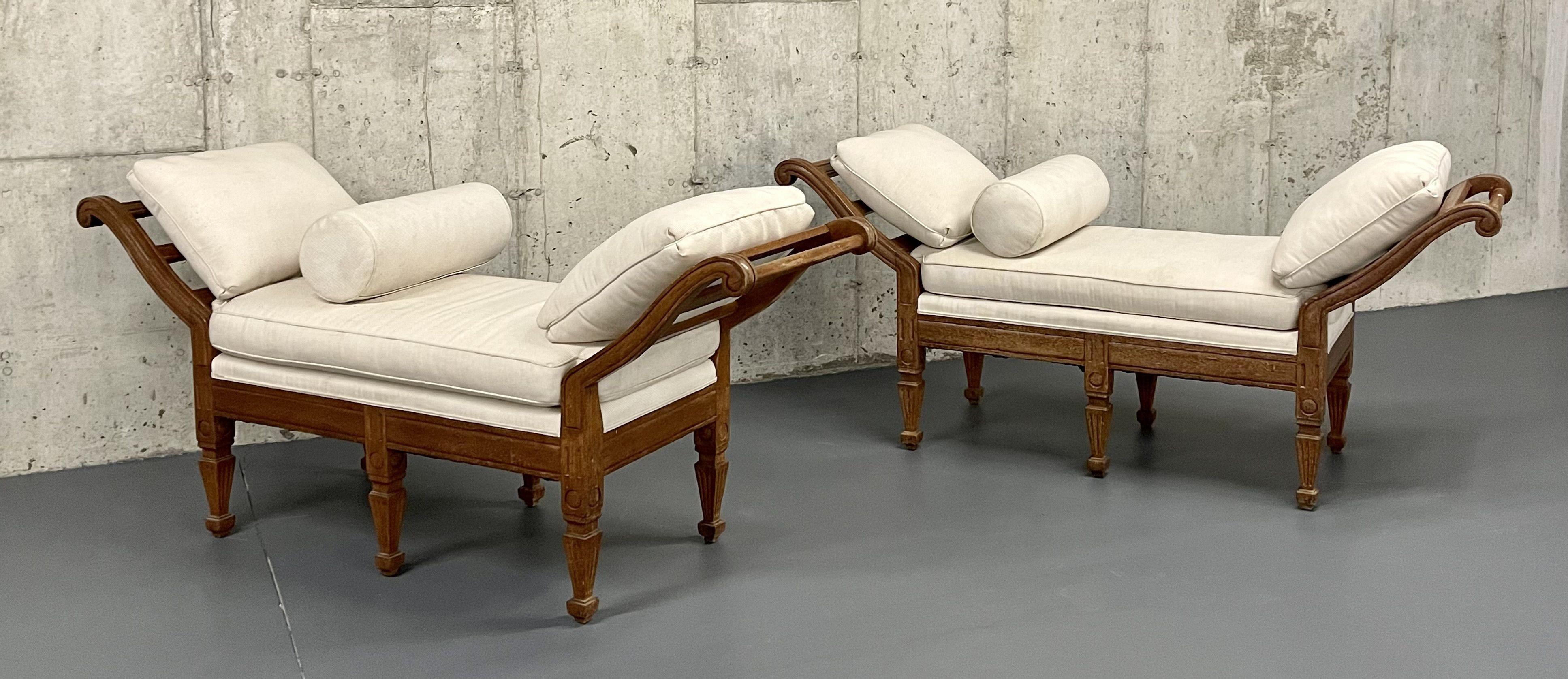 A Pair of Window Benches or Daybeds of Palatial Form having wood frames in the Louis XVI Style with large drop down arms to create a daybed effect. The pair upholstered recently by D Hurieux Upholsters in PA. Can purchase one or the pair. Priced by