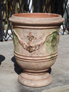 Pair of Mid Sized Distressed Terra Cotta Planters from Anduze, France