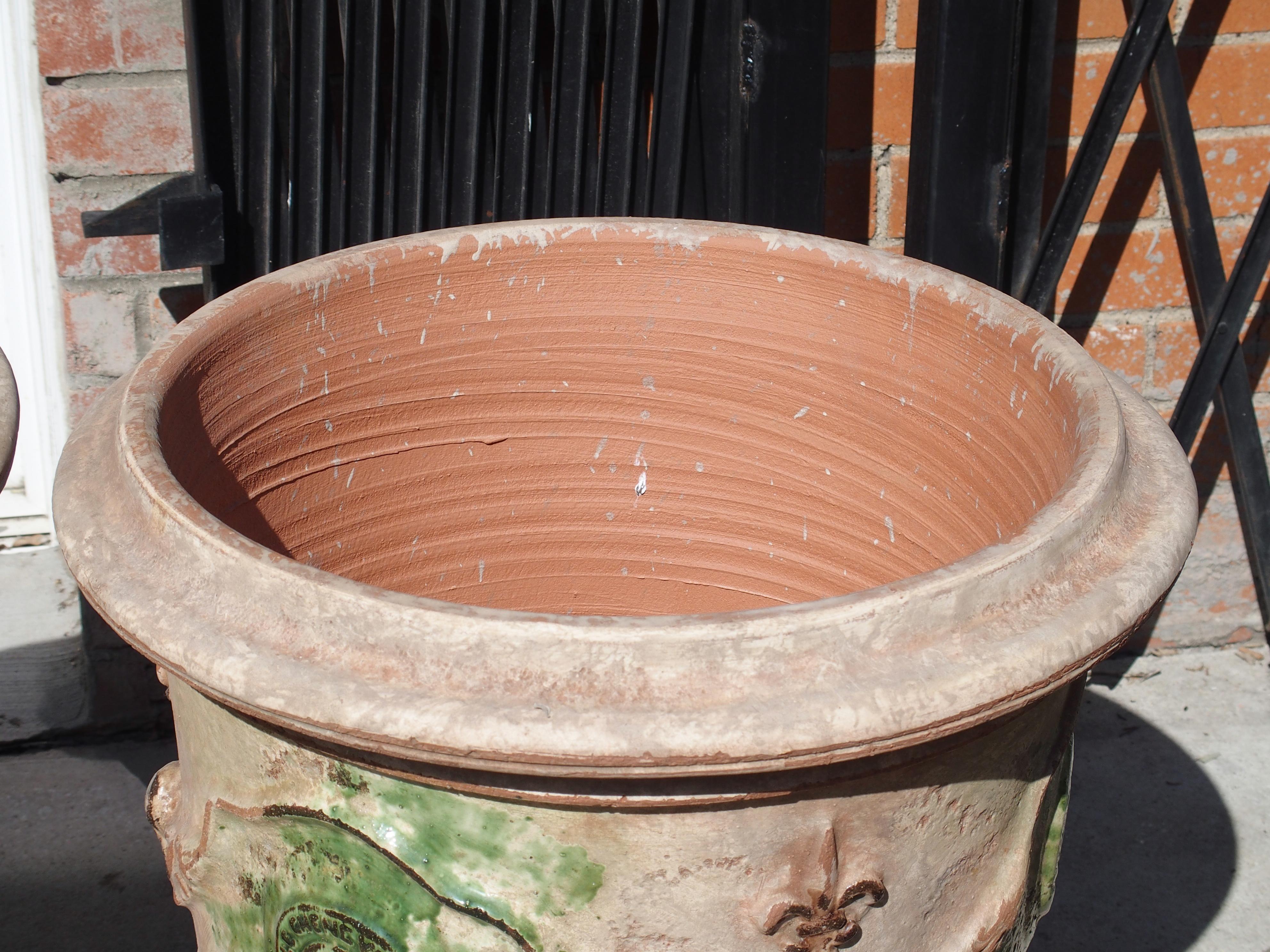 Contemporary Pair of Mid Sized Distressed Terra Cotta Planters from Anduze, France