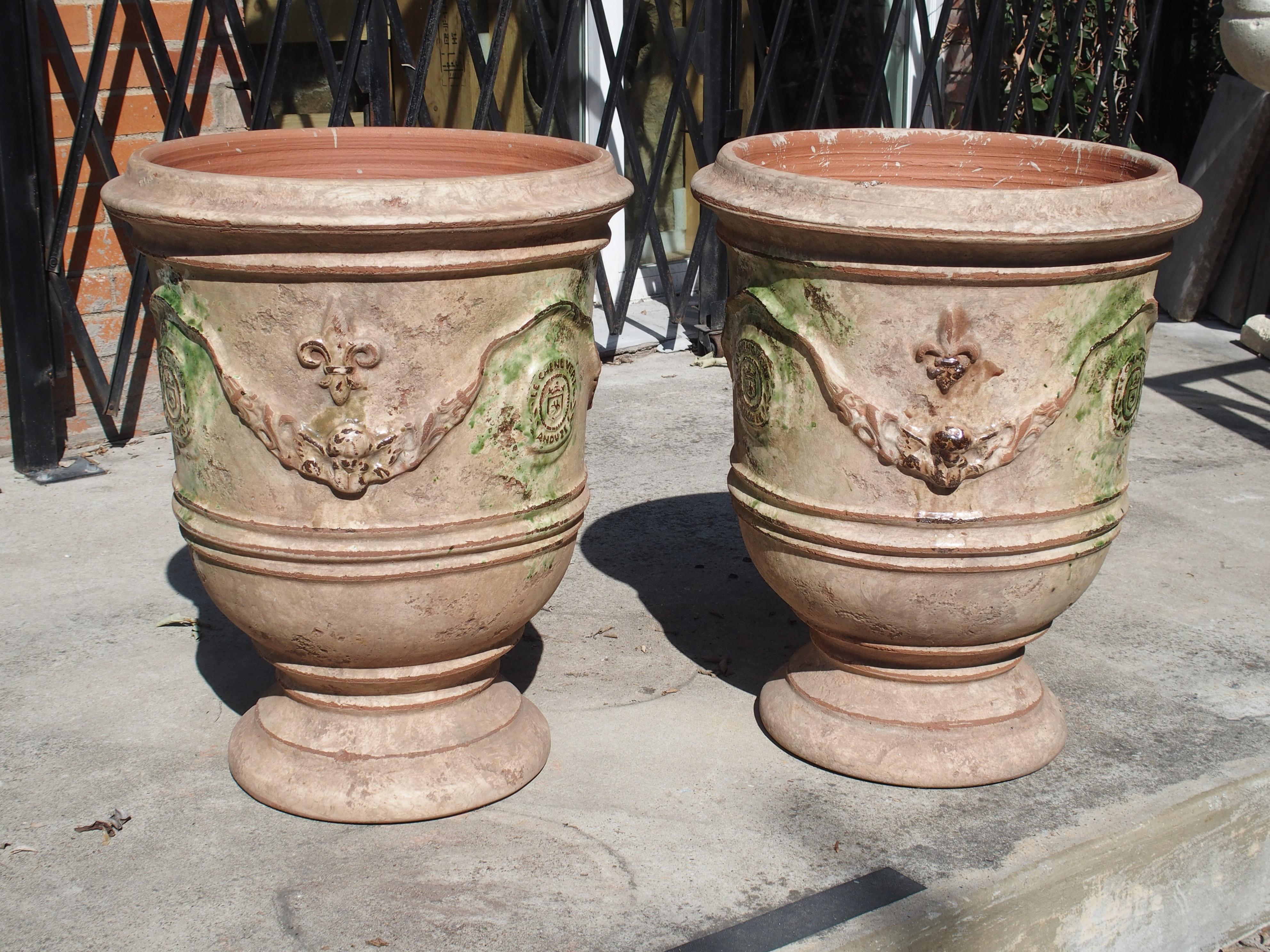 Terracotta Pair of Mid Sized Distressed Terra Cotta Planters from Anduze, France