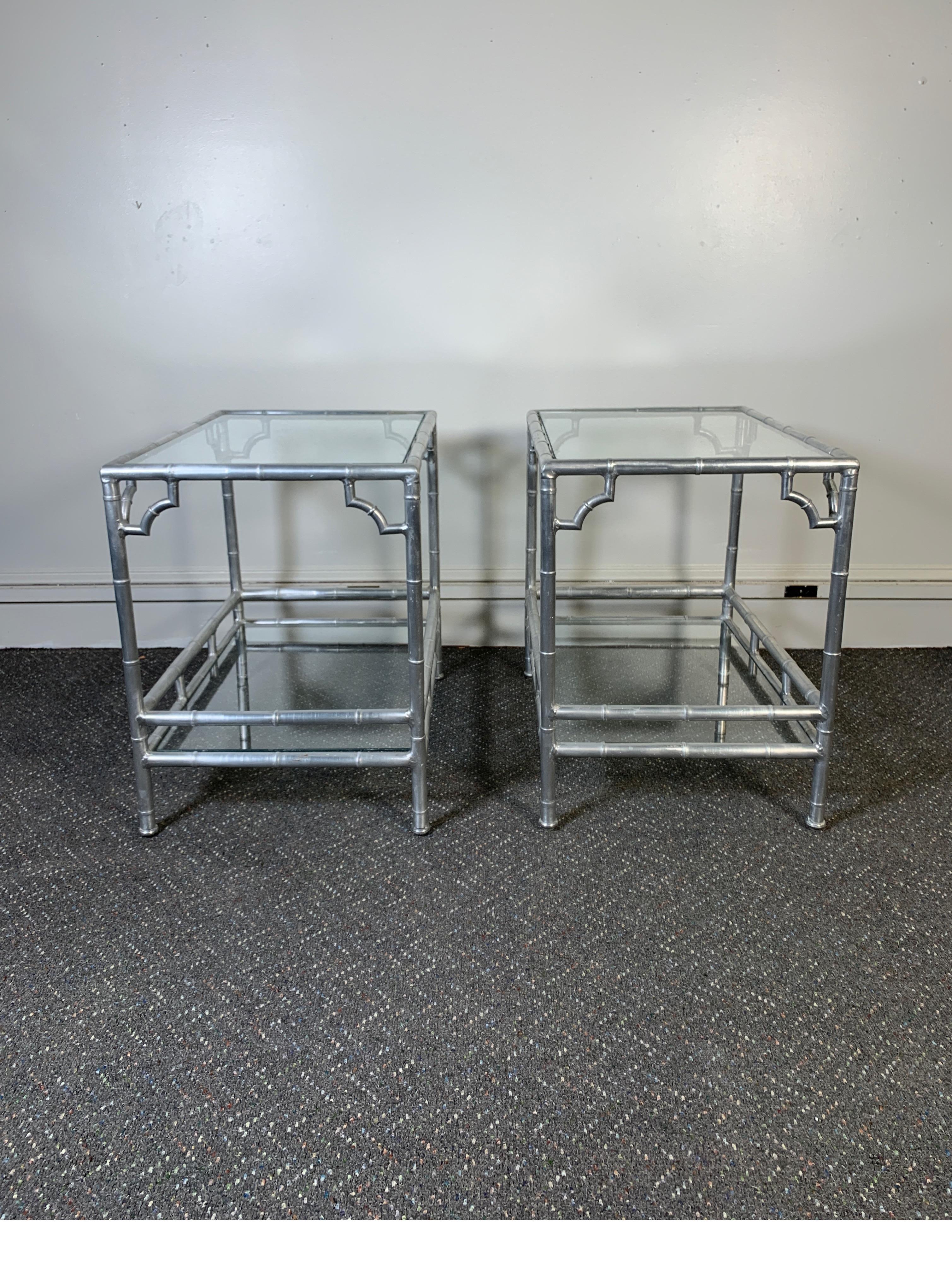 Pair of midcentury 1960s-1970s aluminum faux bamboo side tables with glass shelves.
Very good original condition
Dimensions: 26
