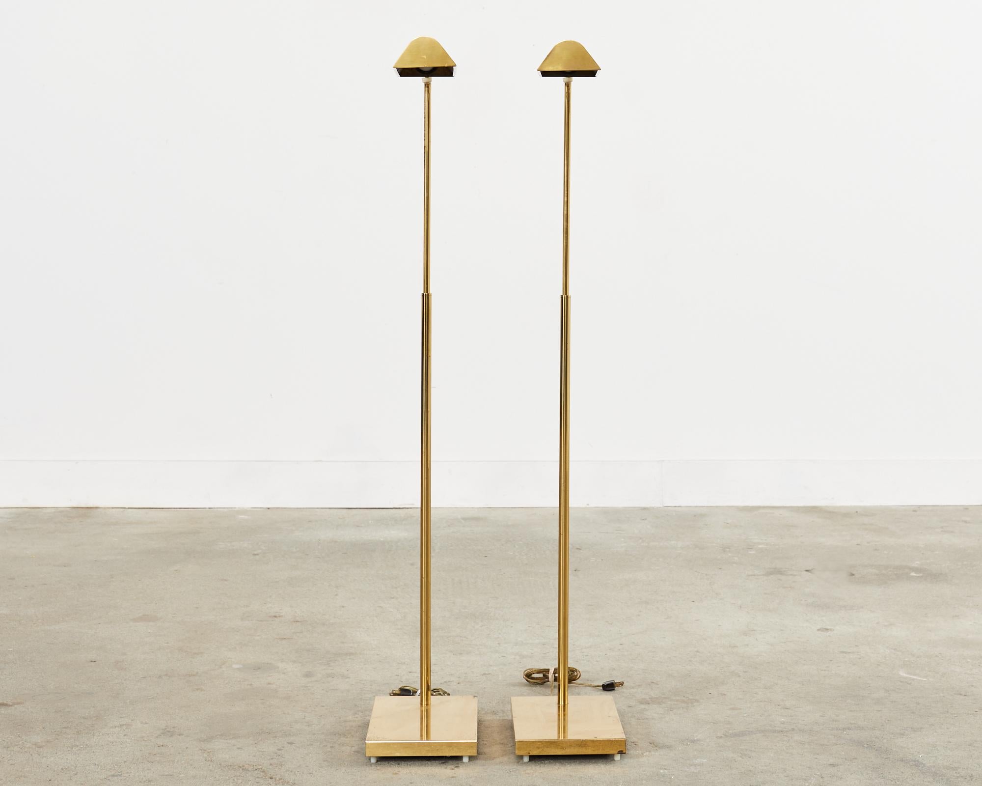 Patinated Pair of Midcentury Adjustable Pharmacy Brass Floor Lamps by Casella For Sale