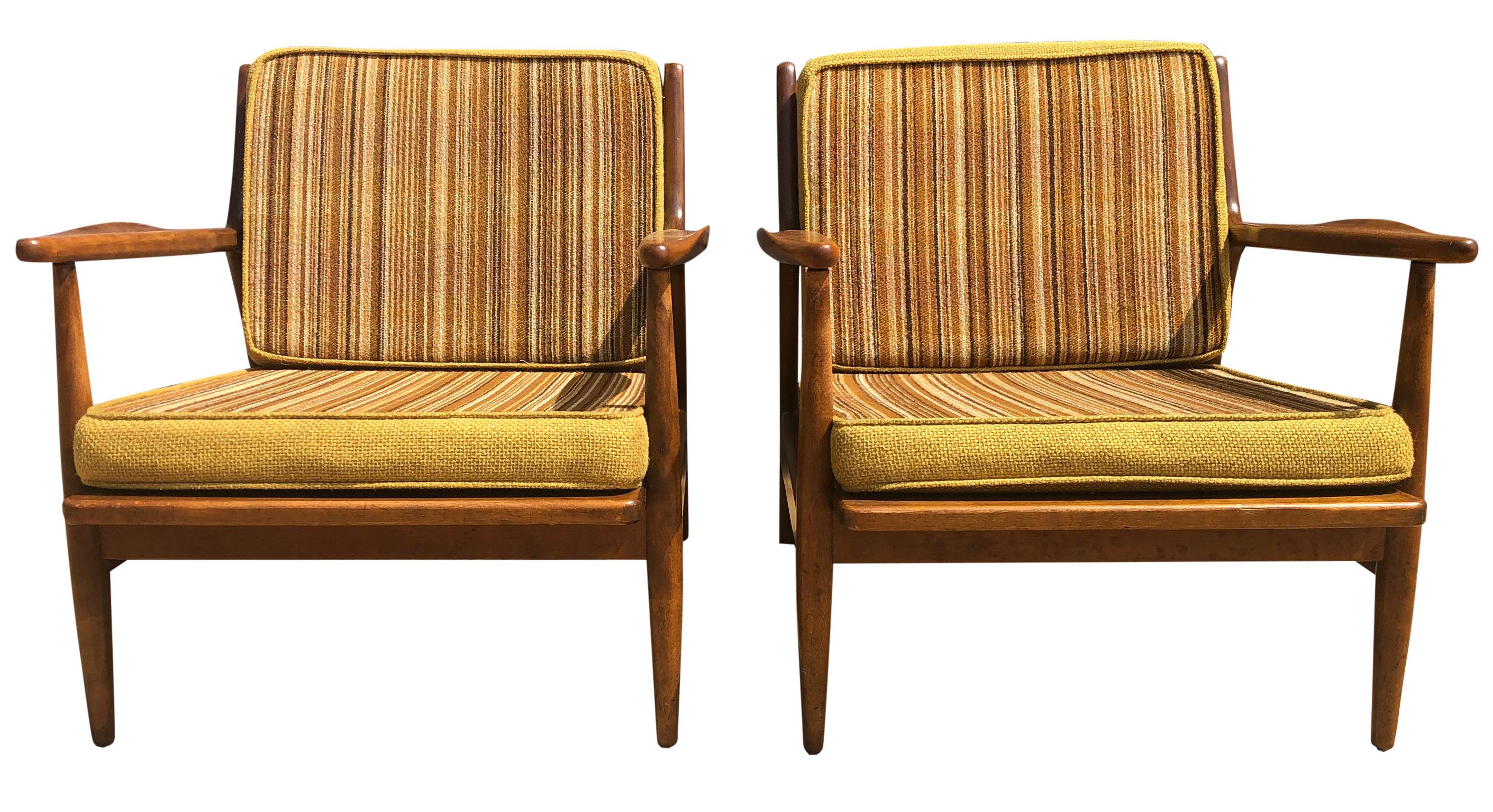 Pair of original midcentury Russel Wright for Conant Ball All maple low lounge chairs. Arms have unique upward curve - great lines. Solid Maple frames with spindle back and all Original yellow/brown striped upholstery. Original vintage condition