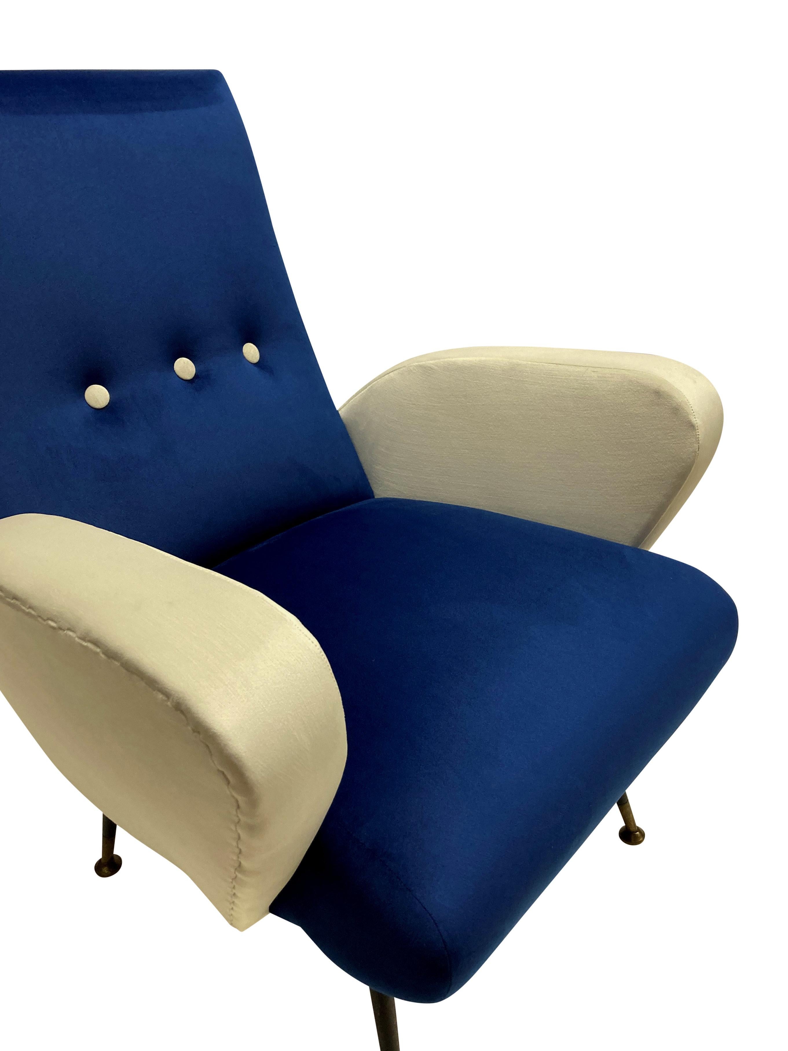 A pair of Italian mid-century armchairs by Nino Zoncada. On taperinglegs and newly upholstered in blue & cream velvet.