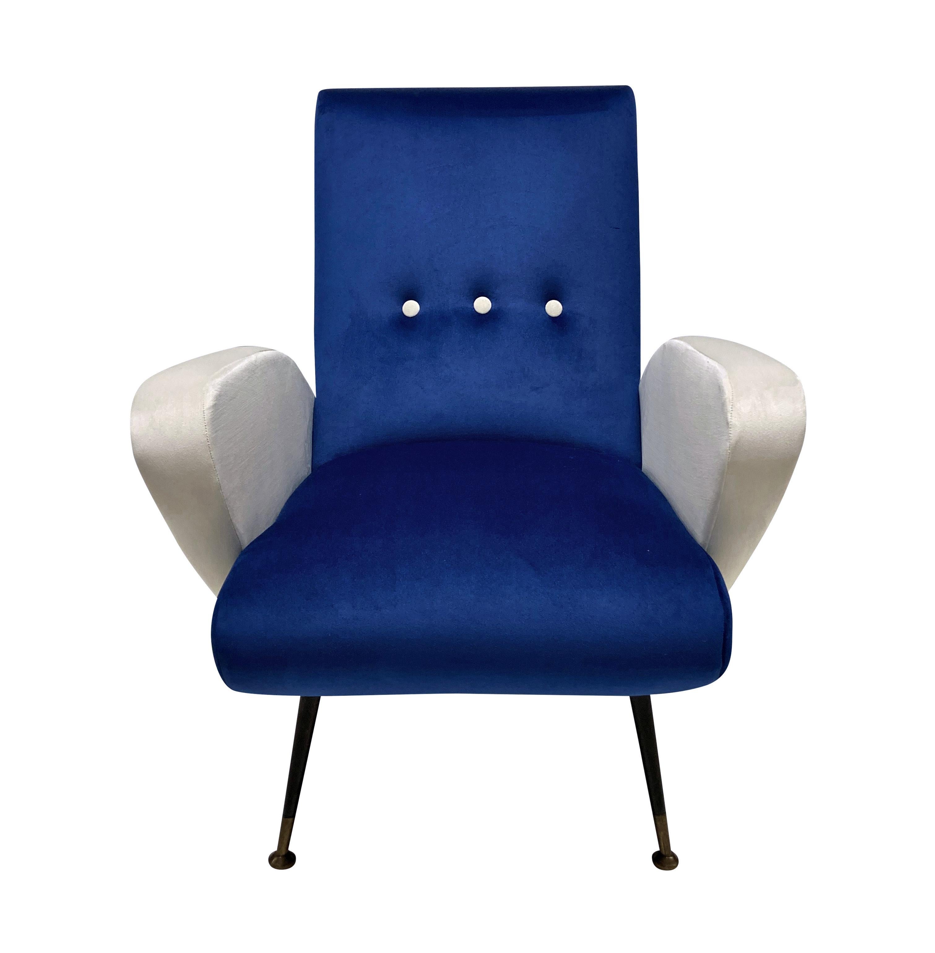 A pair of Italian Mid-Century armchairs by Nino Zoncada. On tapering legs and newly upholstered in blue & cream velvet.